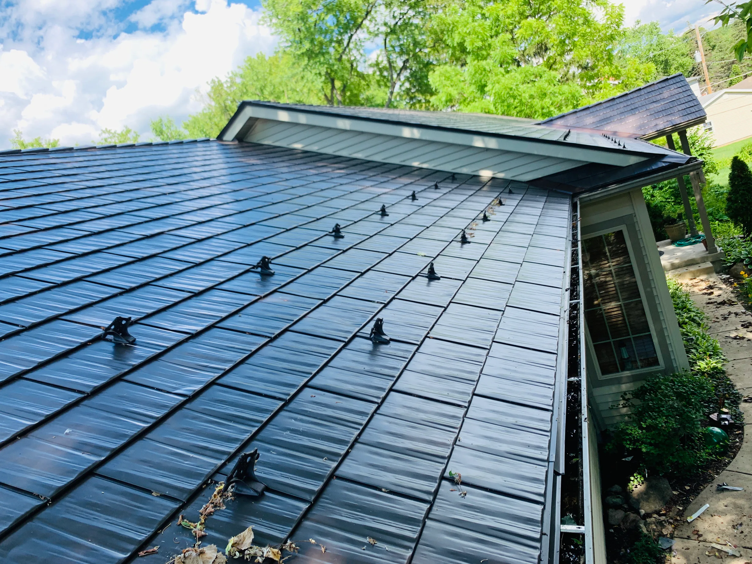 Tudor Brown Interlock Cedar Shingle aluminum roof on a Tudor brown metal roof on a colonial home in a forested, Algonquin, Illinois