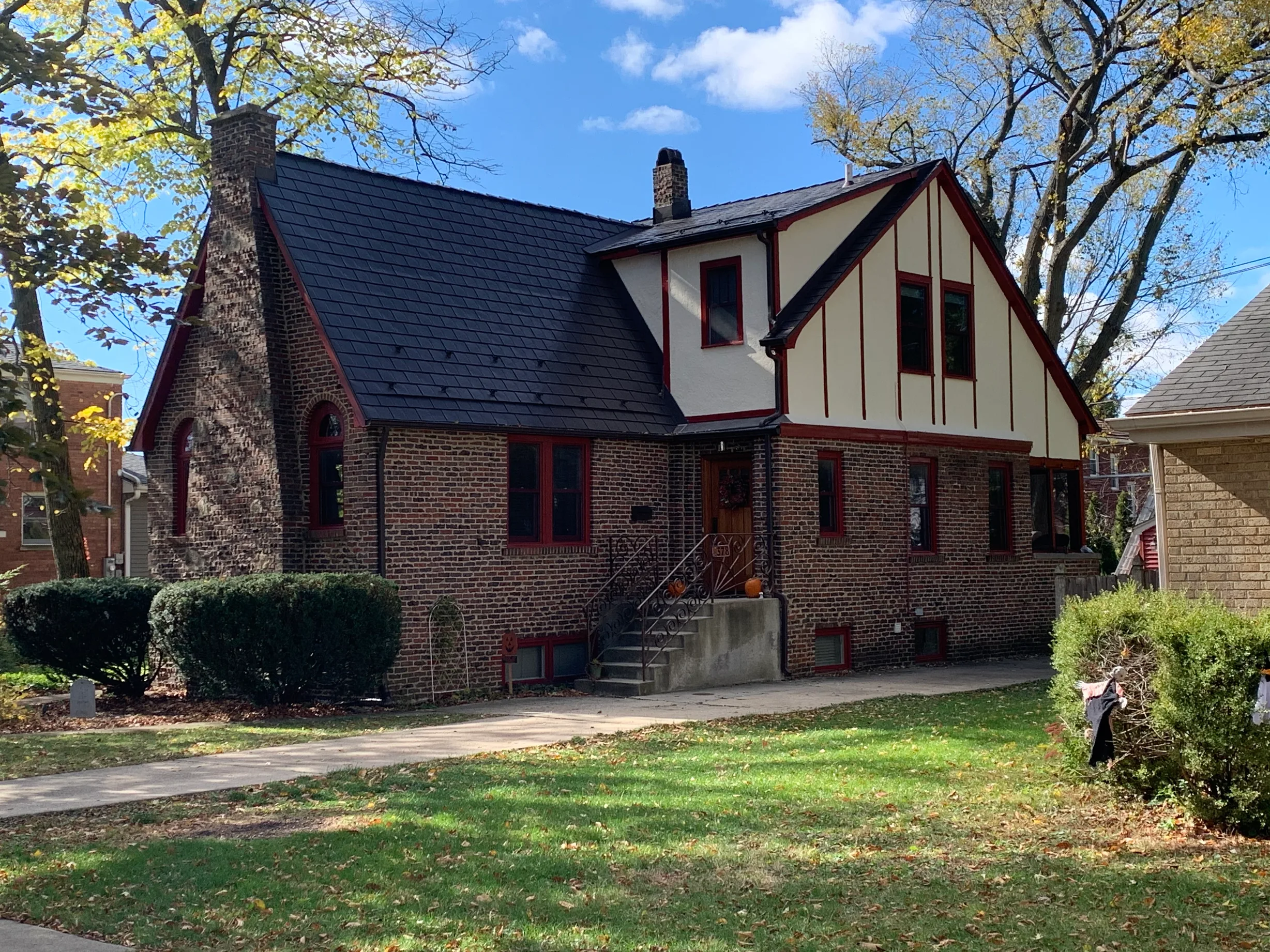 Tudor Brown Interlock Slate aluminum roof on a Tudor brown metal roof on a brick house in a suburban, Elmhurst, Illinois