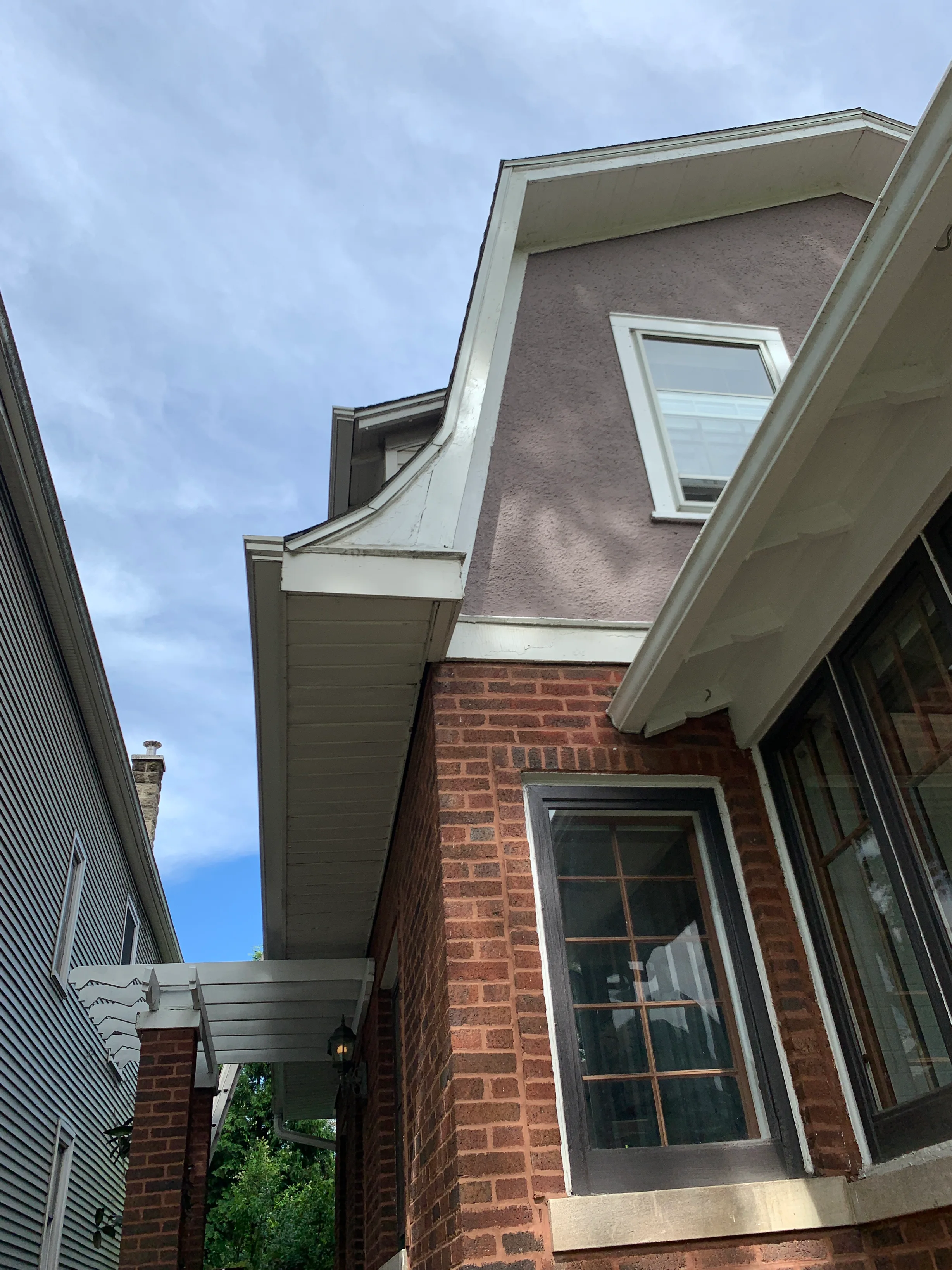 Black Interlock Slate aluminum roof being installed on the home, replacing a worn out asphalt shingle roof, Oak Park, Illinois