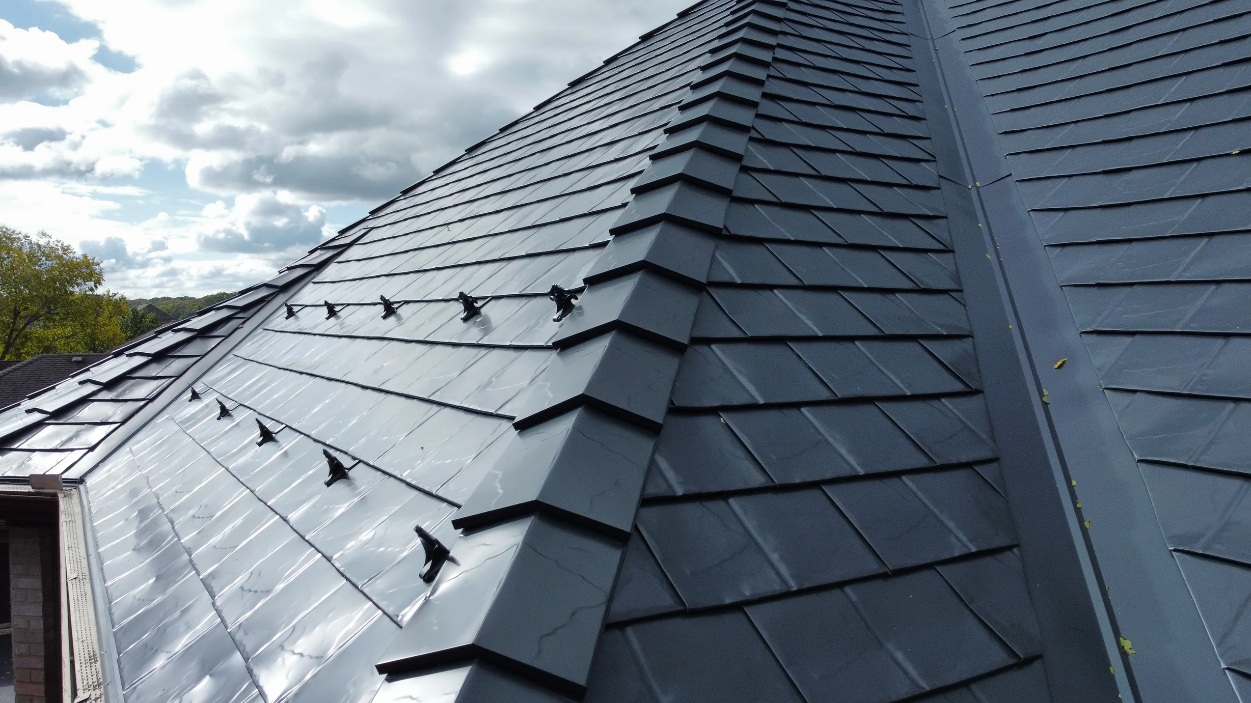 Black Interlock Slate aluminum roof on a black house with an Interlock Slate aluminum roof in a, Lemont, Illinois