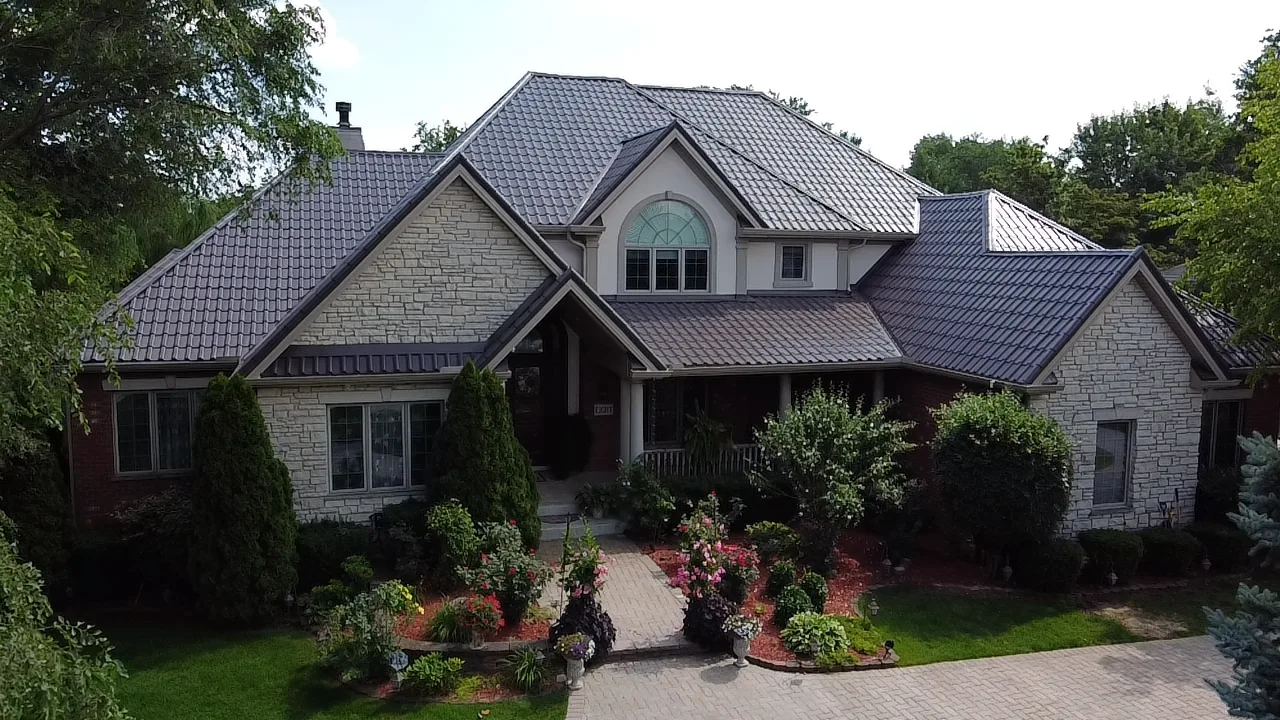 Tudor Brown Interlock Tile aluminum roof on a Tudor-style home with a Tudor Brown metal roof in a, Lemont, Illinois