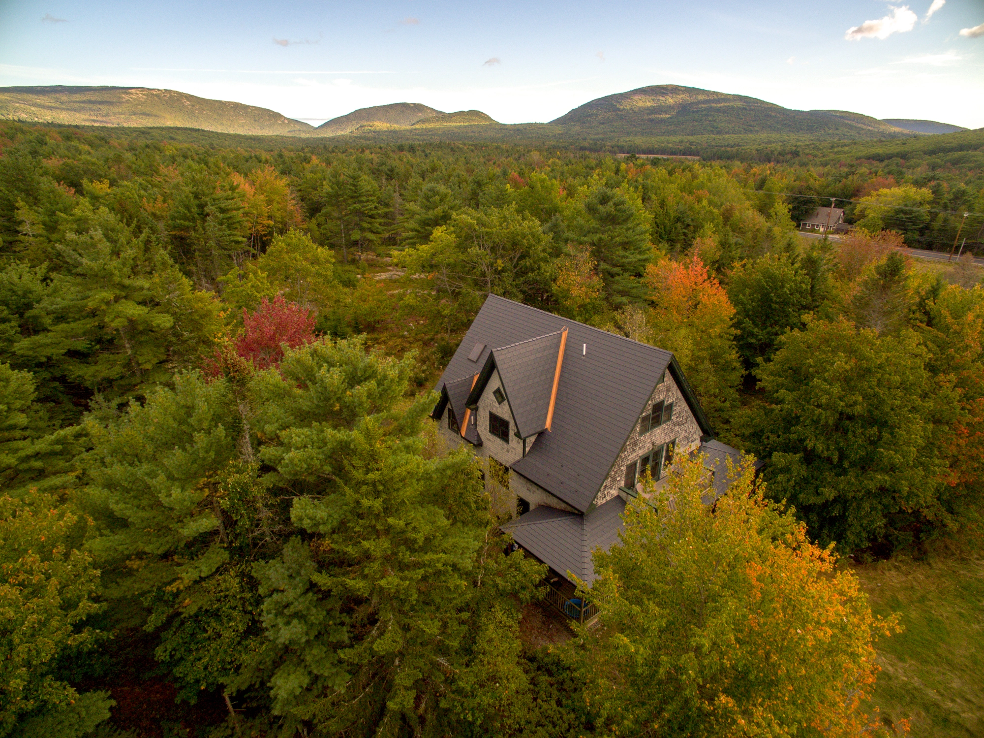 Deep Charcoal Interlock Cedar Shingle aluminum roof on a two-storey home with dormers in a forested mountain, Bar Harbor, Maine