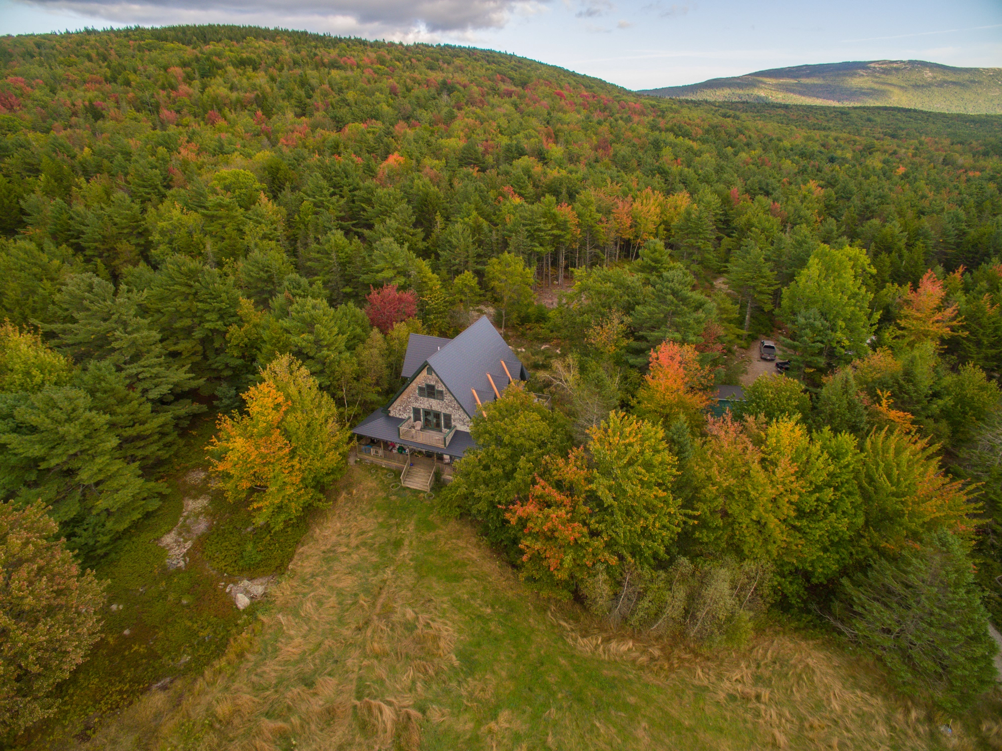Deep Charcoal Interlock Cedar Shingle aluminum roof on a deep charcoal Interlock metal roof on a two-storey home, Bar Harbor, Maine