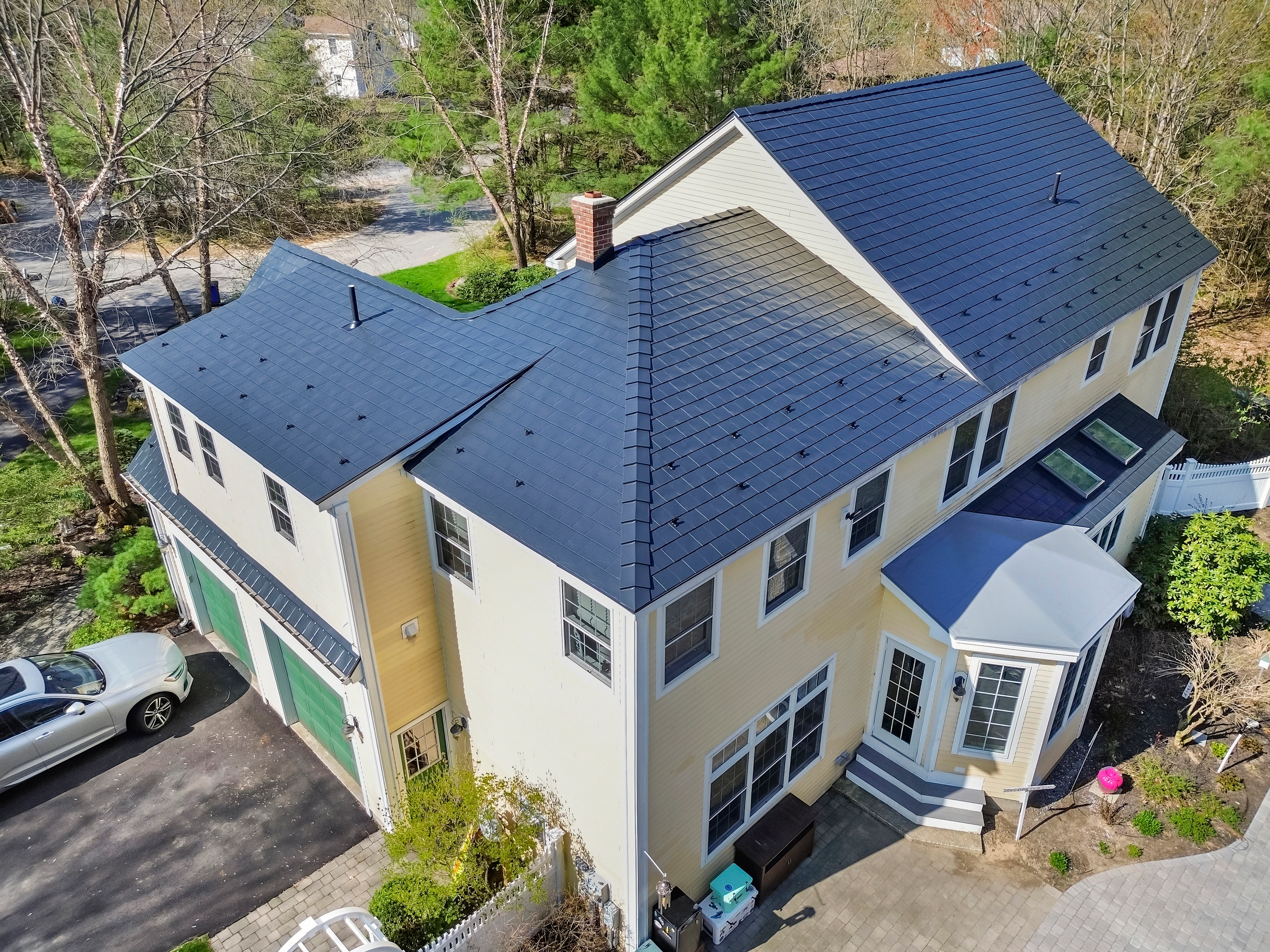 Black Interlock Slate aluminum roof on a two-storey colonial home with a slate metal roof in, Brunswick, Maine