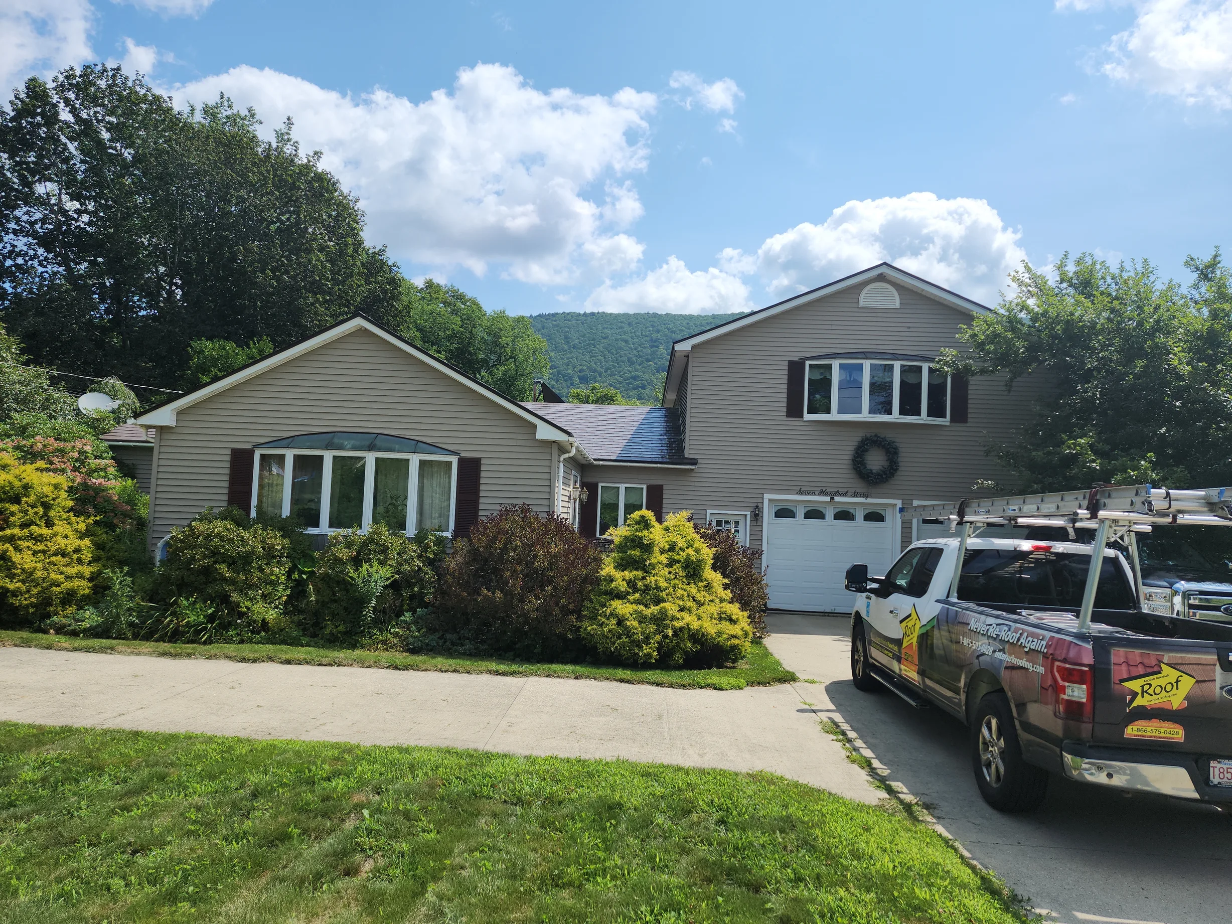 Colonial Brown Interlock Shingle aluminum roof being installed on a colonial home with a brown roof under construction in a, Clarksburg, Massachusetts