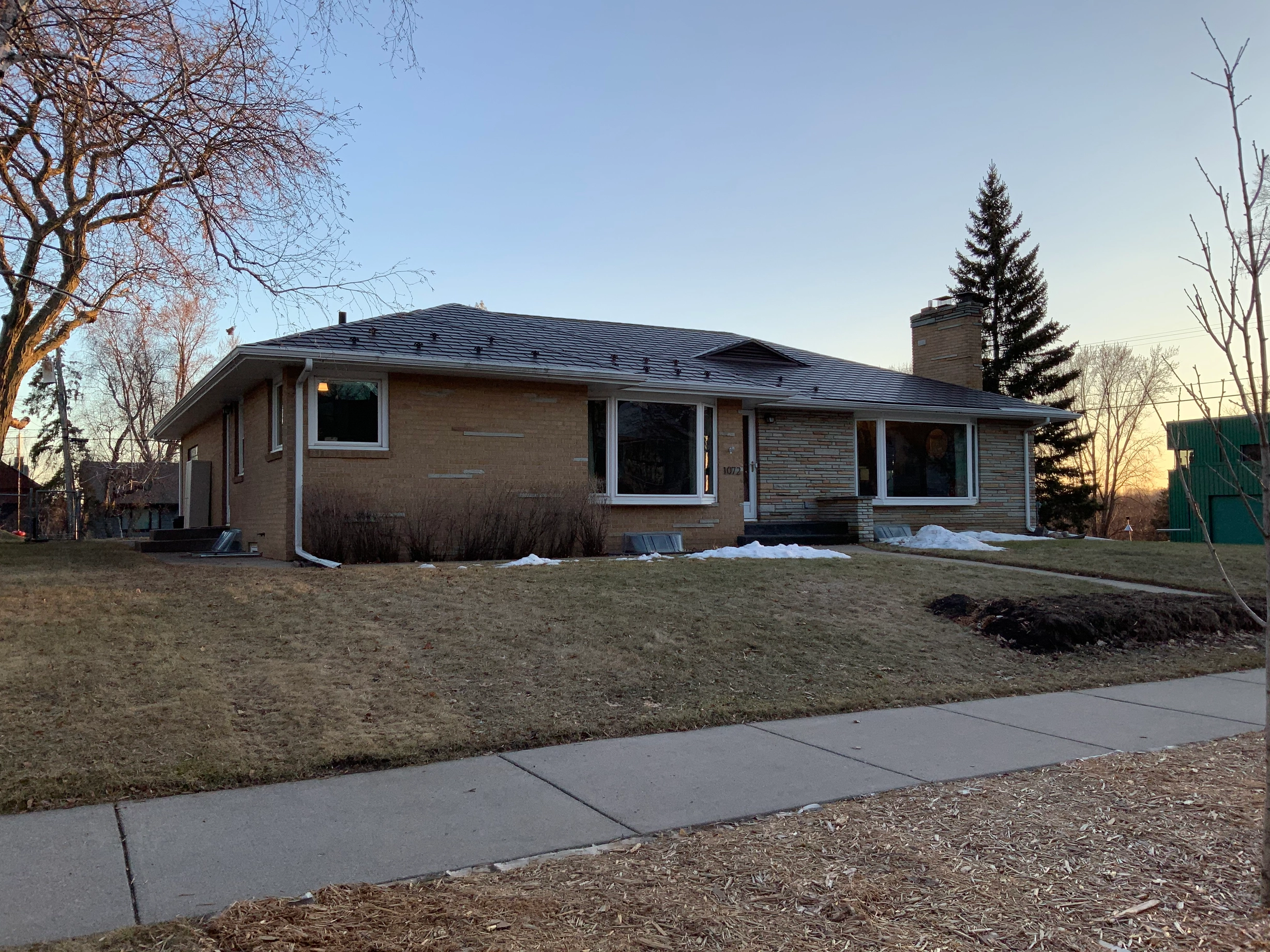 Colonial Brown Interlock Shingle aluminum roof on a brown ranch home with a colonial brown metal roof in a, Saint Paul, Minnesota
