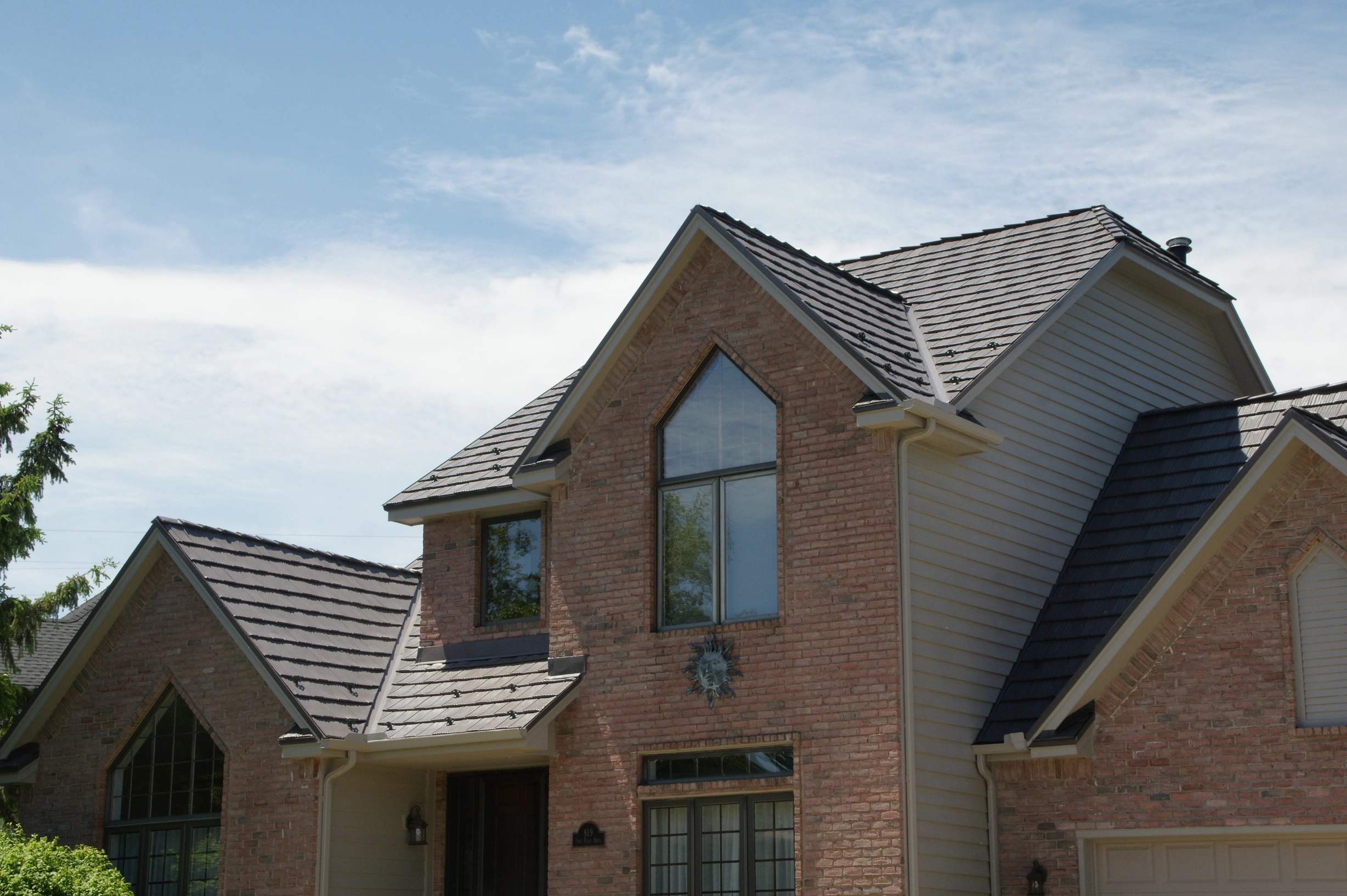 Weathered Interlock Shake aluminum roof on a brick home with a metal roof in a rural area, Mendota Heights, Minnesota