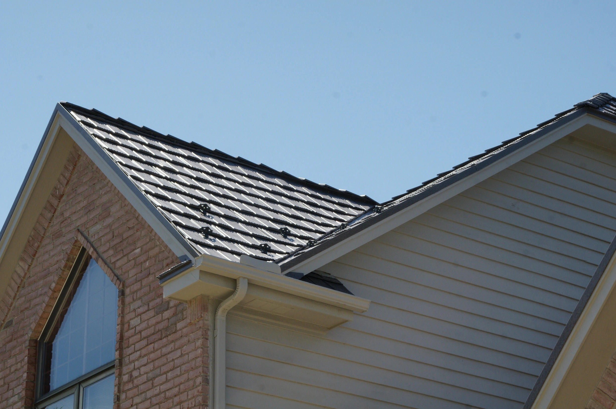 Weathered Interlock Shake aluminum roof on a single-family modern home with brick and siding, Mendota Heights, Minnesota