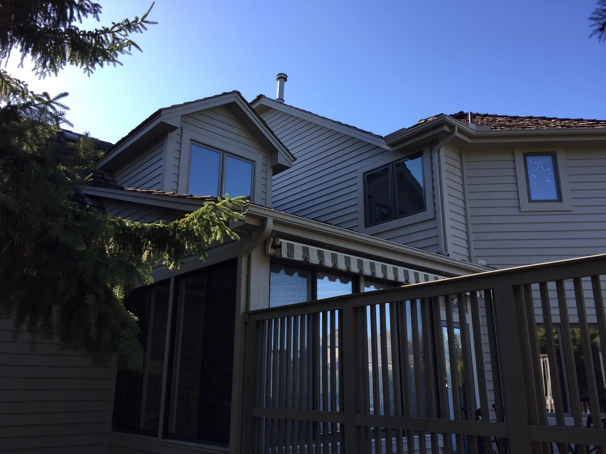 Before: a worn out wood shake roof on the home, Mendota Heights, Minnesota, ahead of a Weathered Interlock Shake aluminum roof