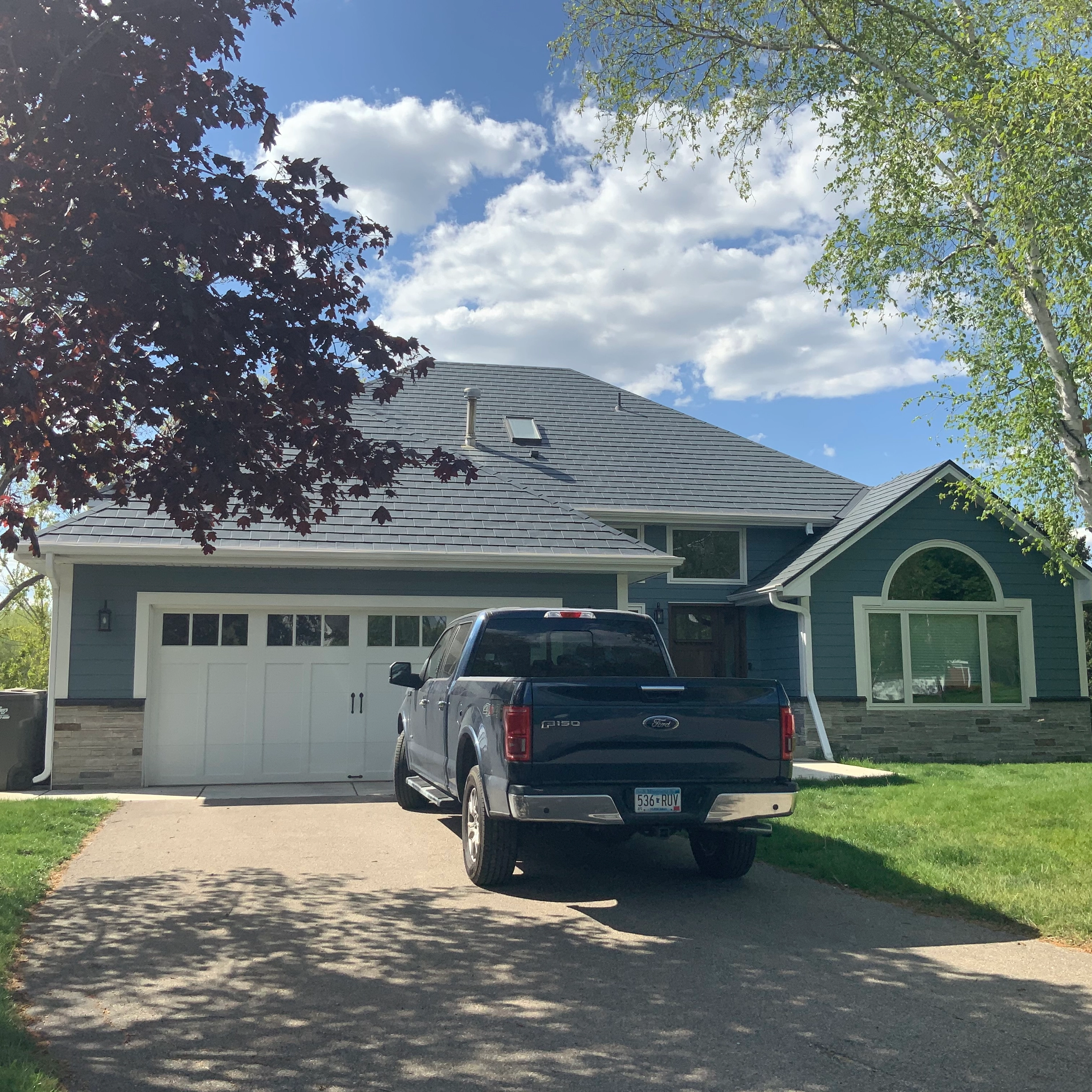 Deep Charcoal Interlock Slate aluminum roof on a two-storey home with dormers in a suburban setting, Eden Prairie, Minnesota