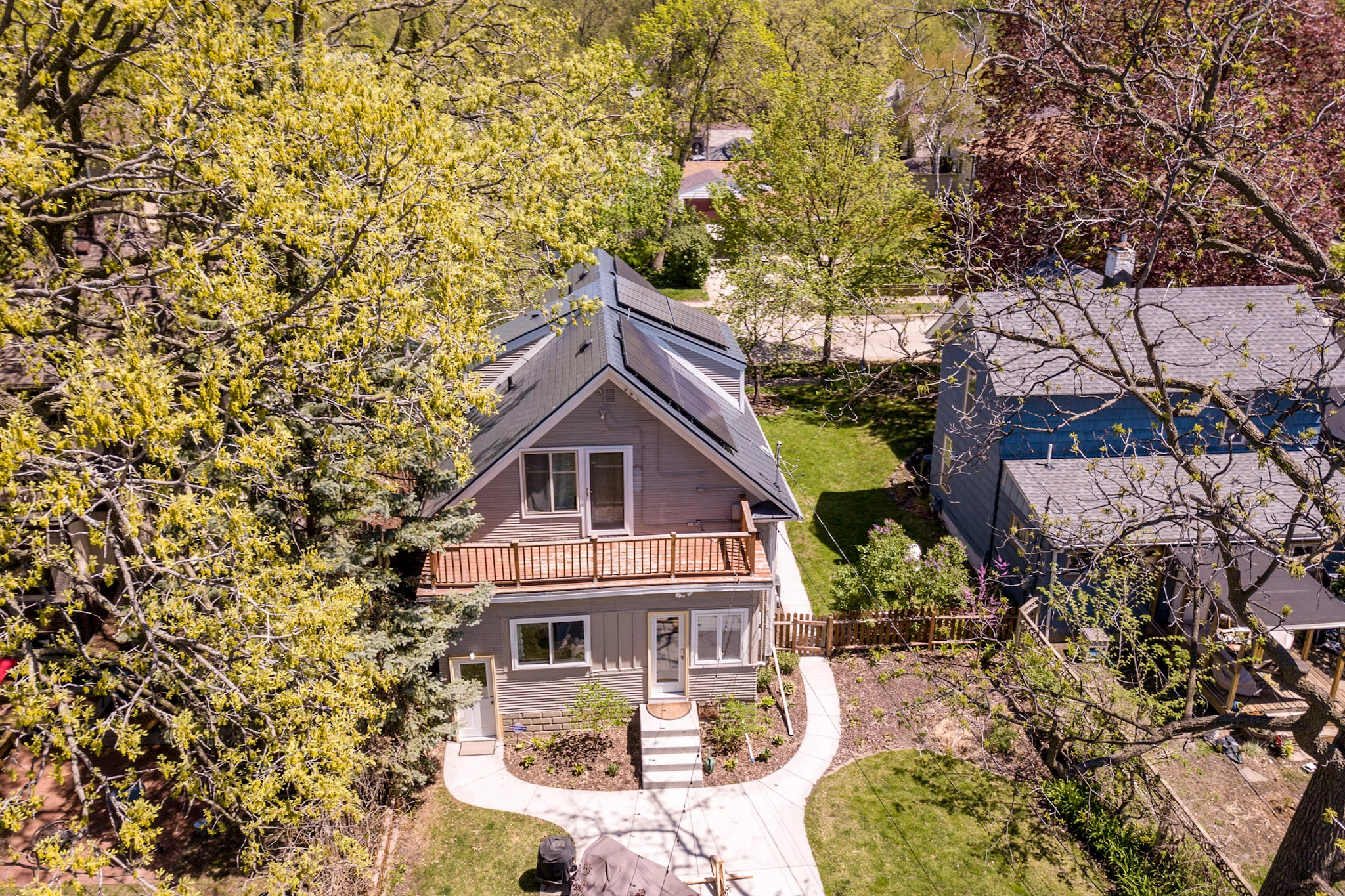 Deep Charcoal Interlock Slate aluminum roof on a Deep Charcoal metal roof on a grey Colonial home in a, Minneapolis, Minnesota