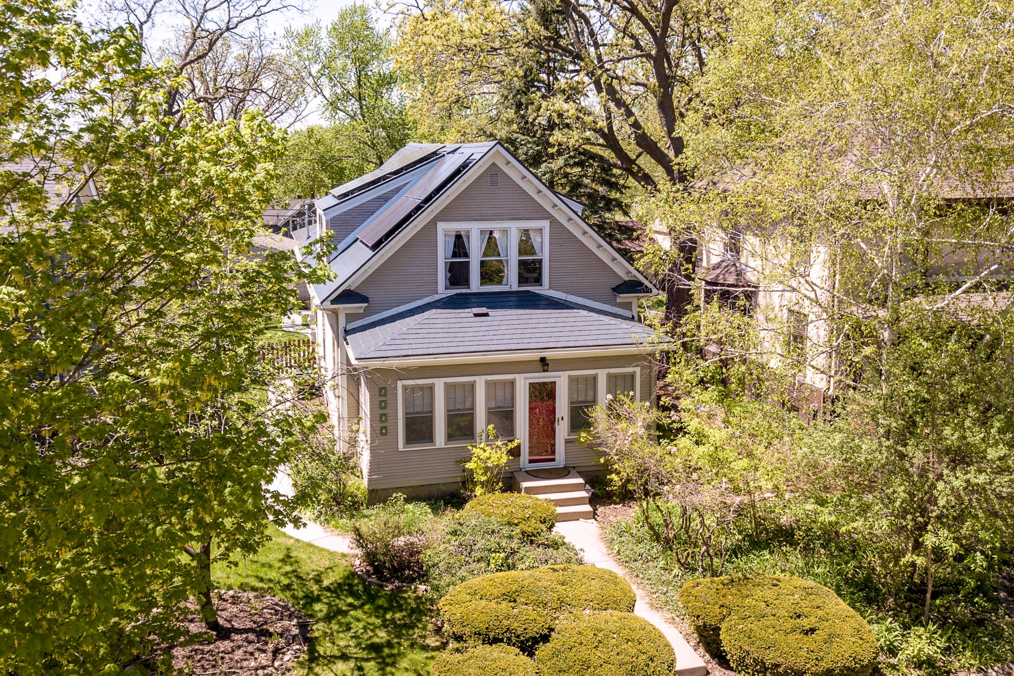Deep Charcoal Interlock Slate aluminum roof on a two-storey craftsman home with a slate metal roof among, Minneapolis, Minnesota