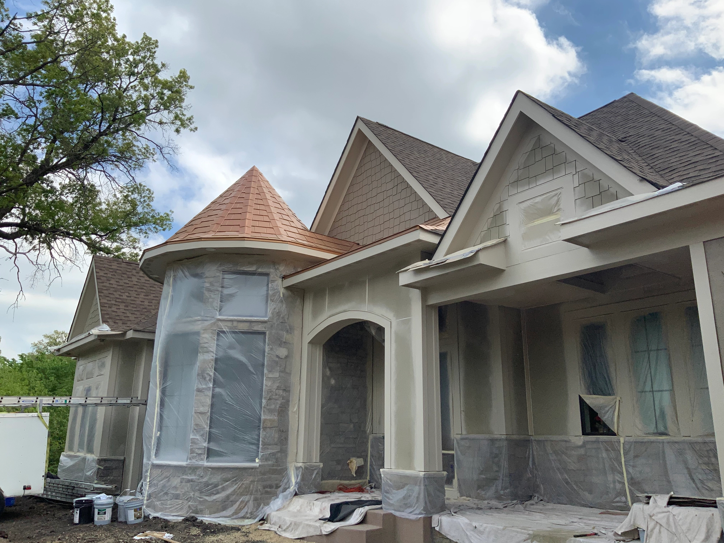 Copper Penny Interlock Slate aluminum roof being installed on the home, replacing a worn out asphalt shingle roof, Prior Lake, Minnesota
