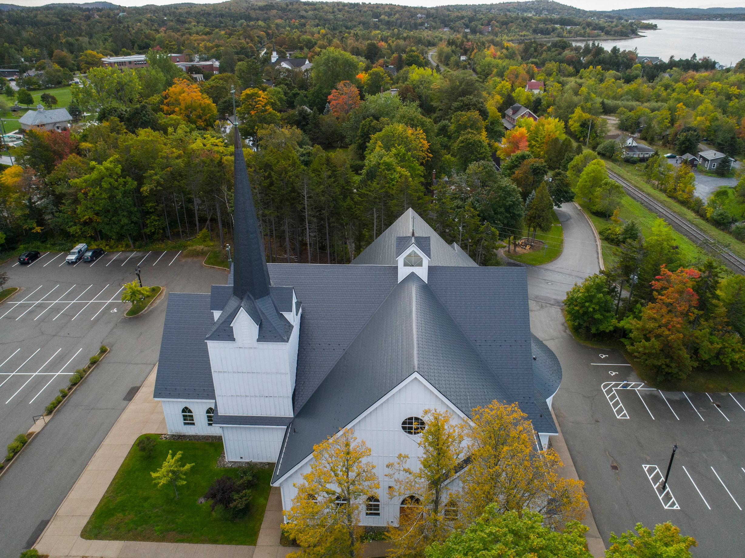 Deep Charcoal Interlock Slate aluminum roof on a church with a deep charcoal metal roof in a forested, Rothesay, New Brunswick