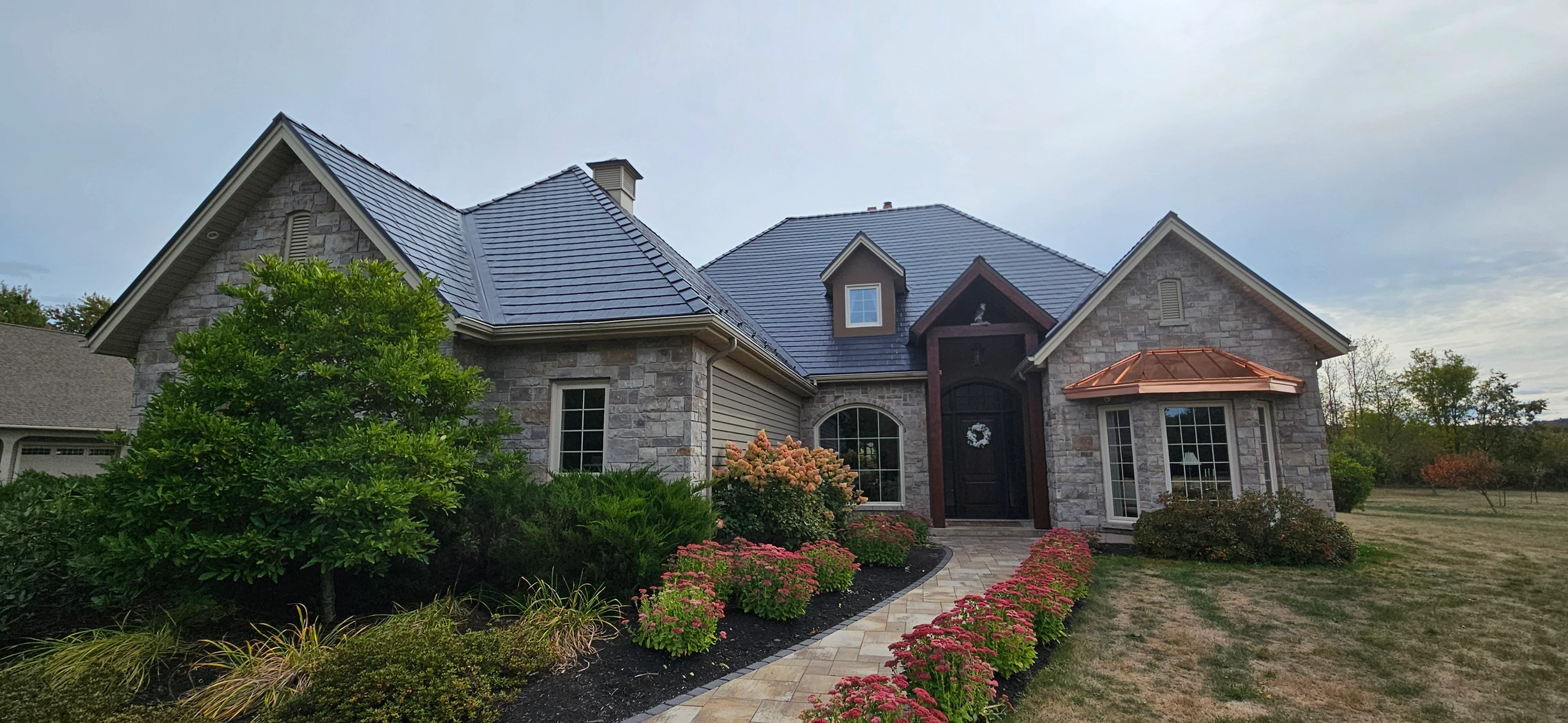 Deep Charcoal Interlock Slate aluminum roof on a ranch style single family home in a rural area, Sussex, New Brunswick