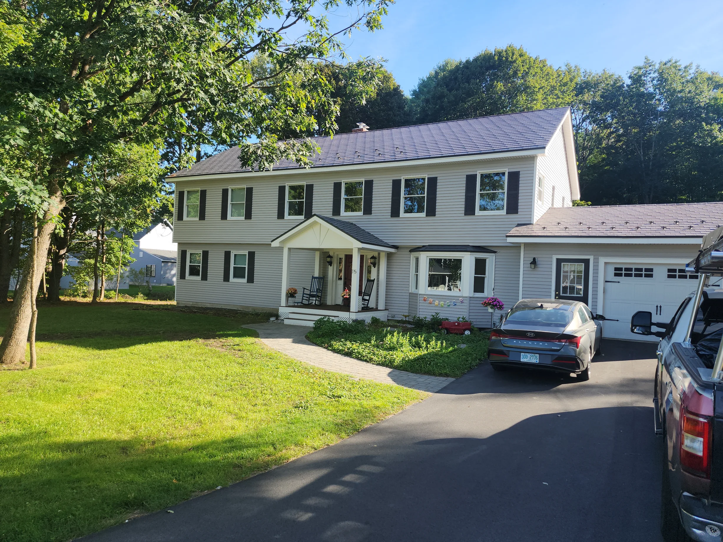 Musket Grey Interlock Slate aluminum roof on a two-storey colonial home with a grey metal roof in a, West Lebanon, New Hampshire