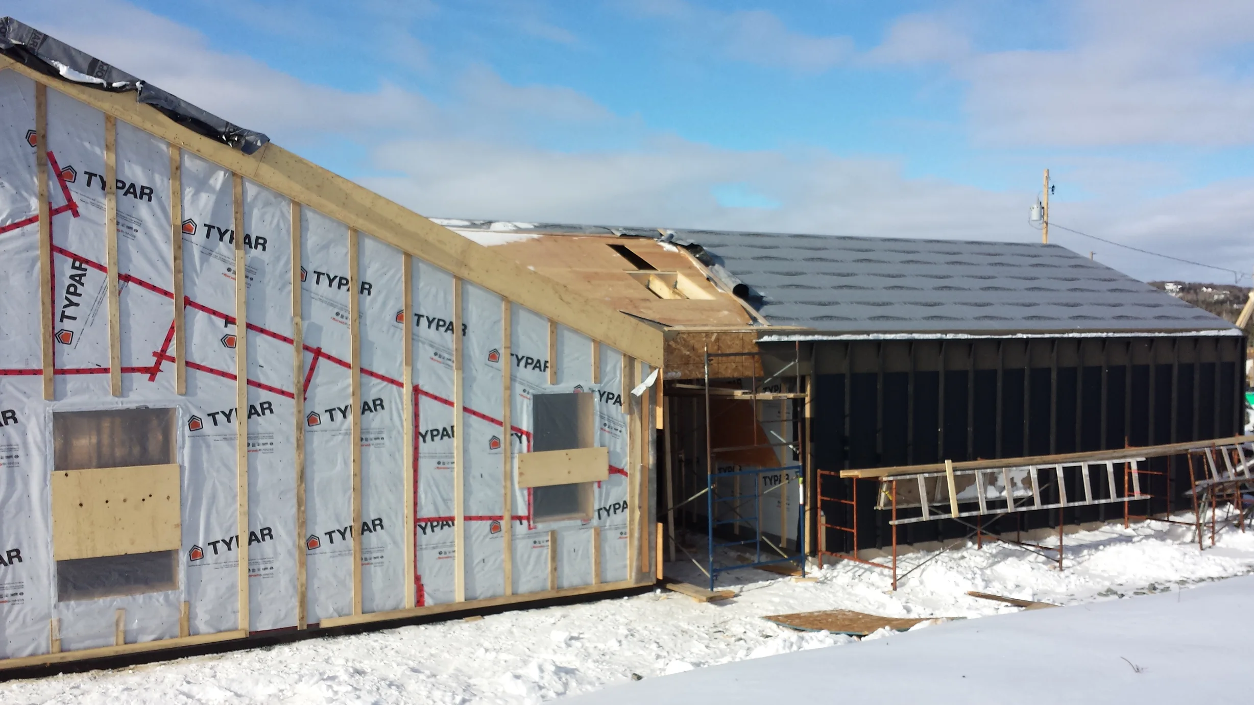 Deep Charcoal Interlock Standing Seam aluminum roof on a Deep Charcoal Interlock Standing Seam roof on a house in, Cow Bay, Nova Scotia
