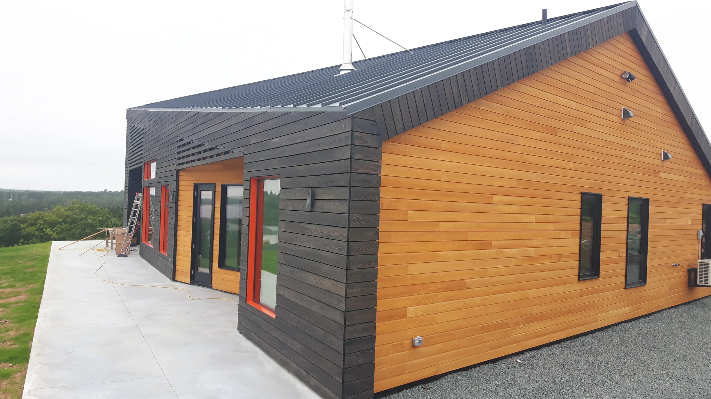 Deep Charcoal Interlock Standing Seam aluminum roof on a house with a metal roof in Cow Bay, Nova Scotia, Cow Bay, Nova Scotia