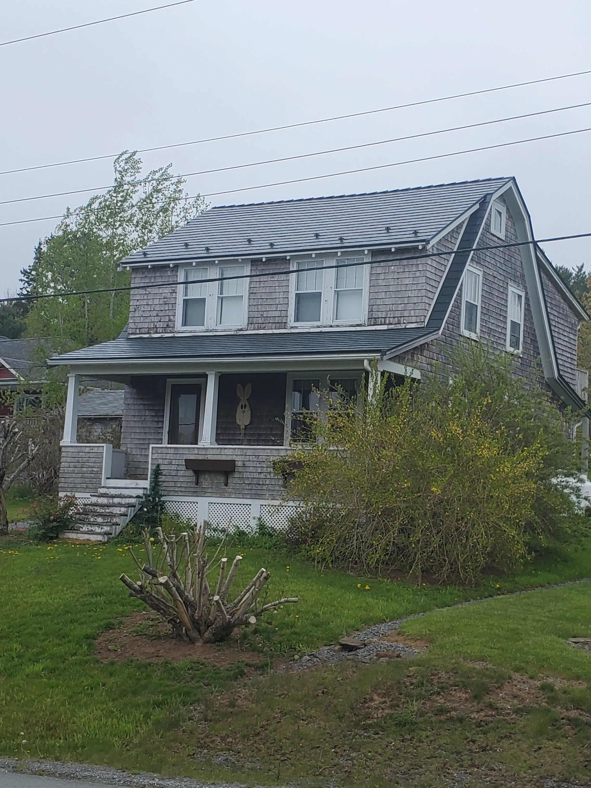 Deep Charcoal Interlock Cedar Shingle aluminum roof on the home, Lunenburg, Nova Scotia