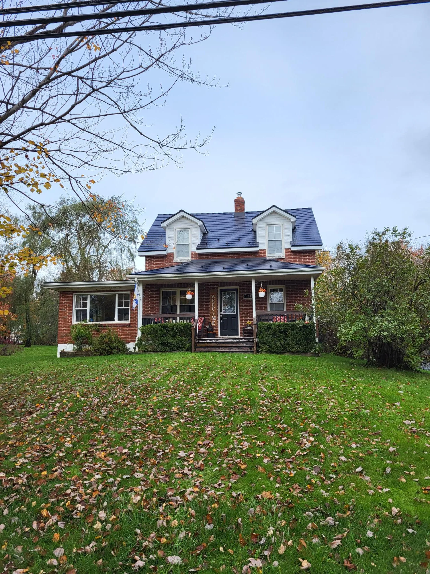 Black Interlock Cedar Shingle aluminum roof on the home, Lantz, Nova Scotia
