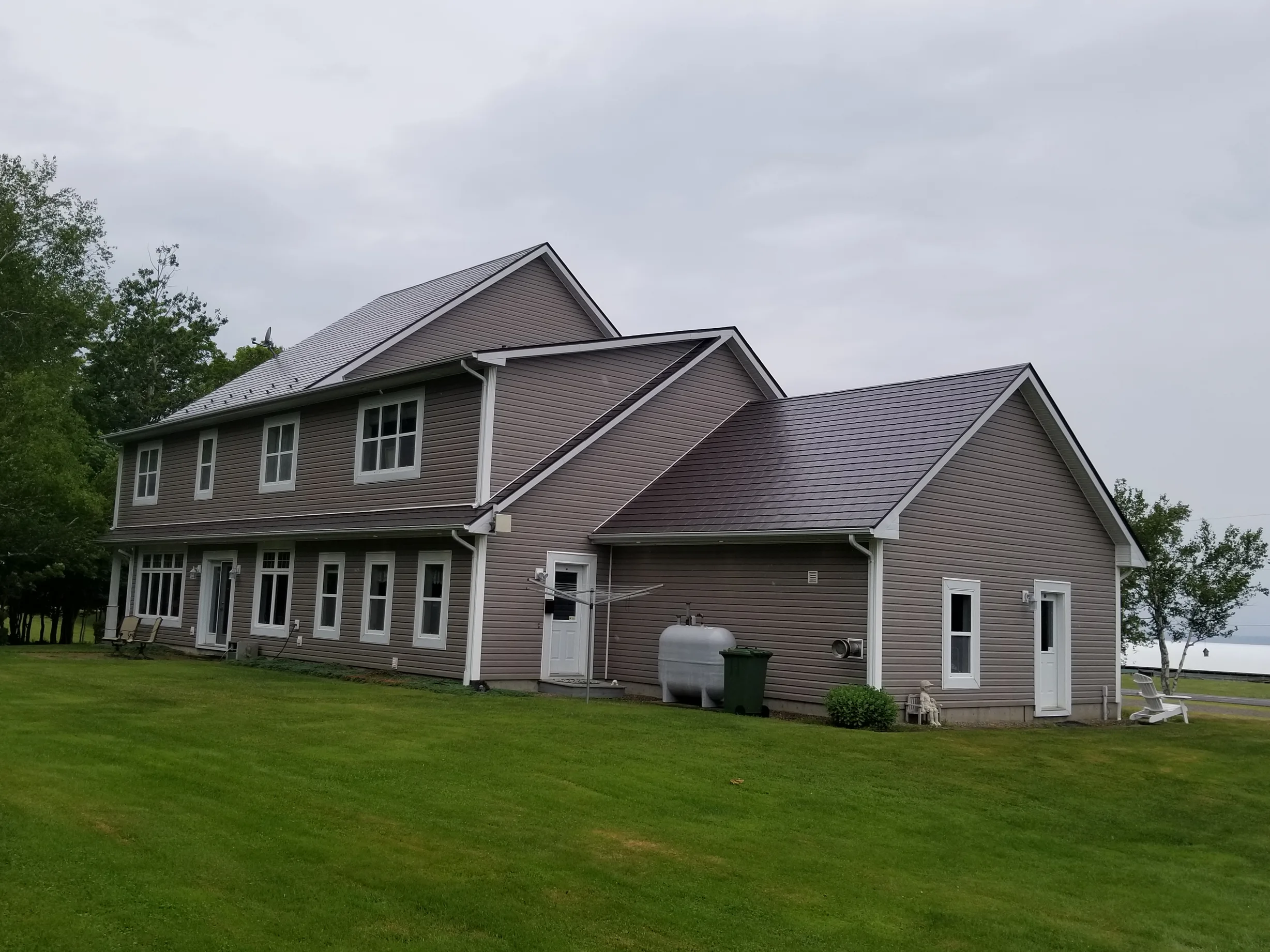 Tudor Brown Interlock Slate aluminum roof on the home, Canning, Nova Scotia