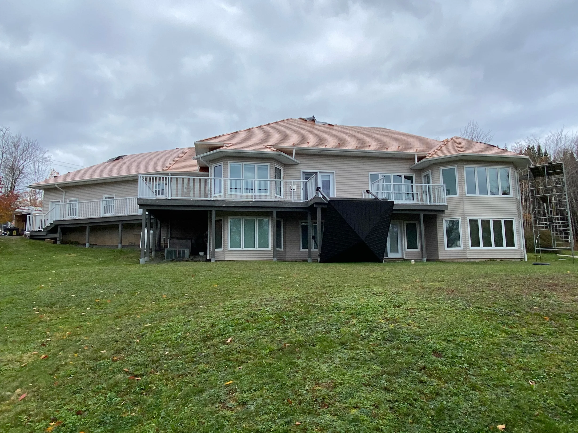 Copper Penny Interlock Slate aluminum roof on the home with ridge cap, Wolfville, Nova Scotia