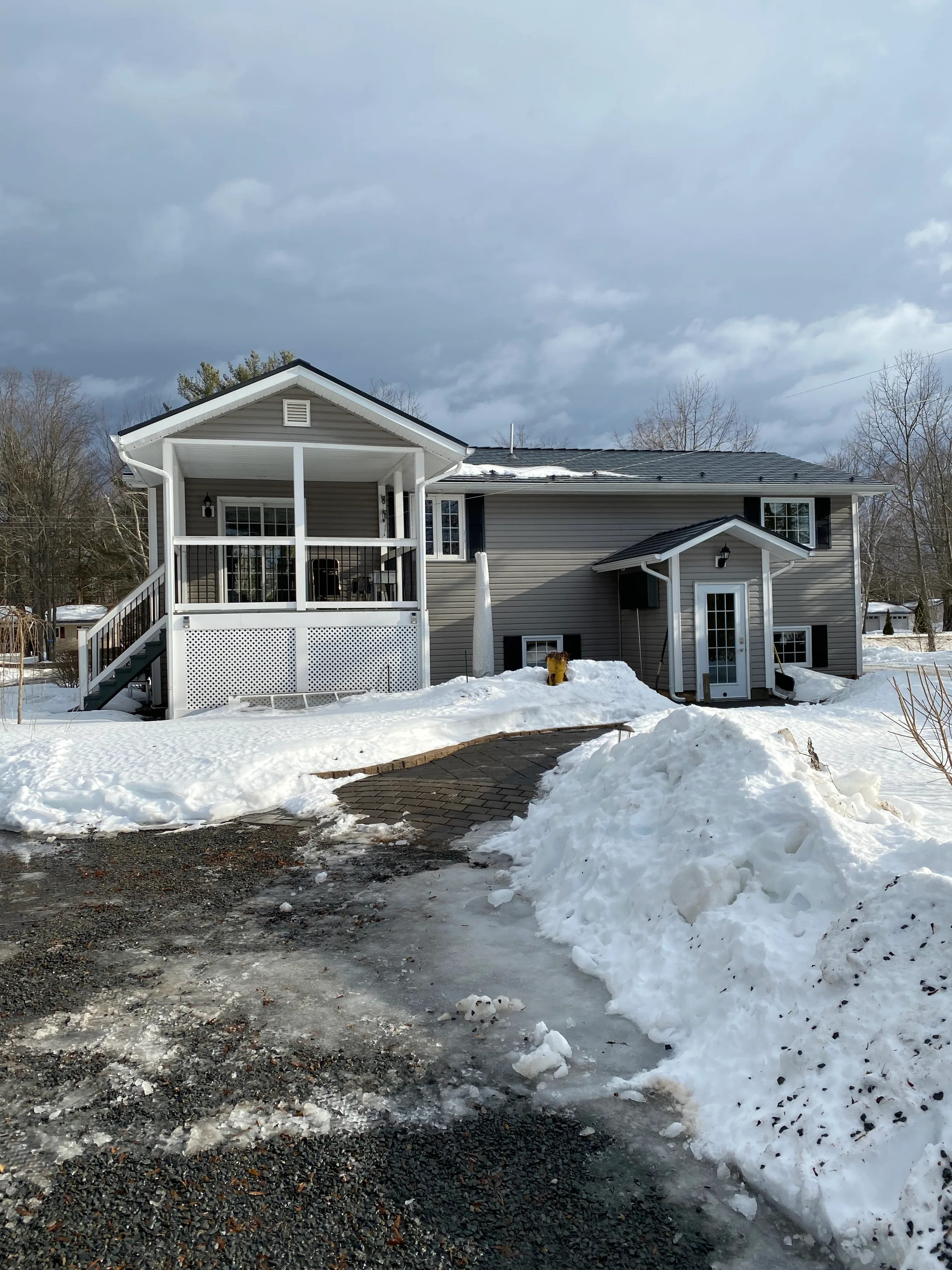 Deep Charcoal Interlock Cedar Shingle aluminum roof on the home, Centreville, Nova Scotia