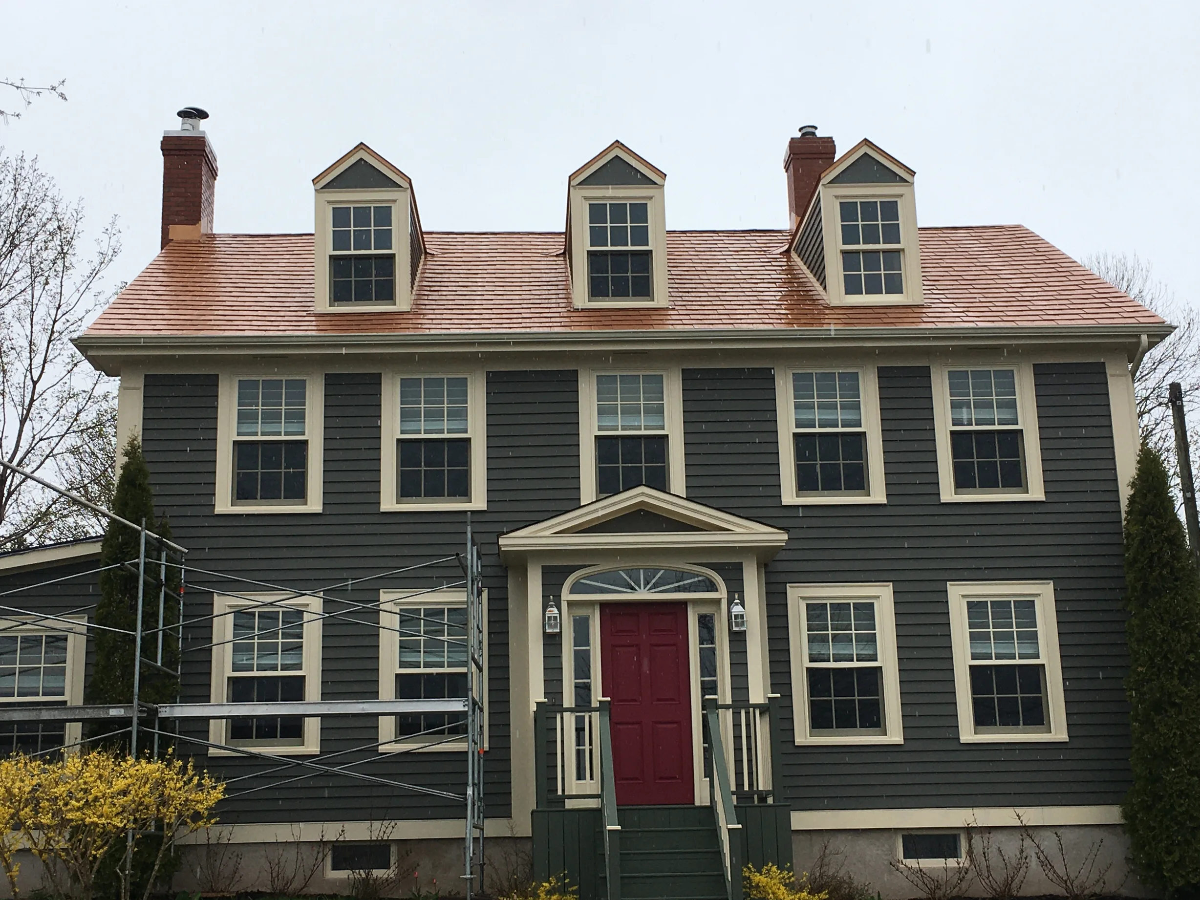 Copper Penny Interlock Slate aluminum roof on the home with chimney, Granville Ferry, Nova Scotia