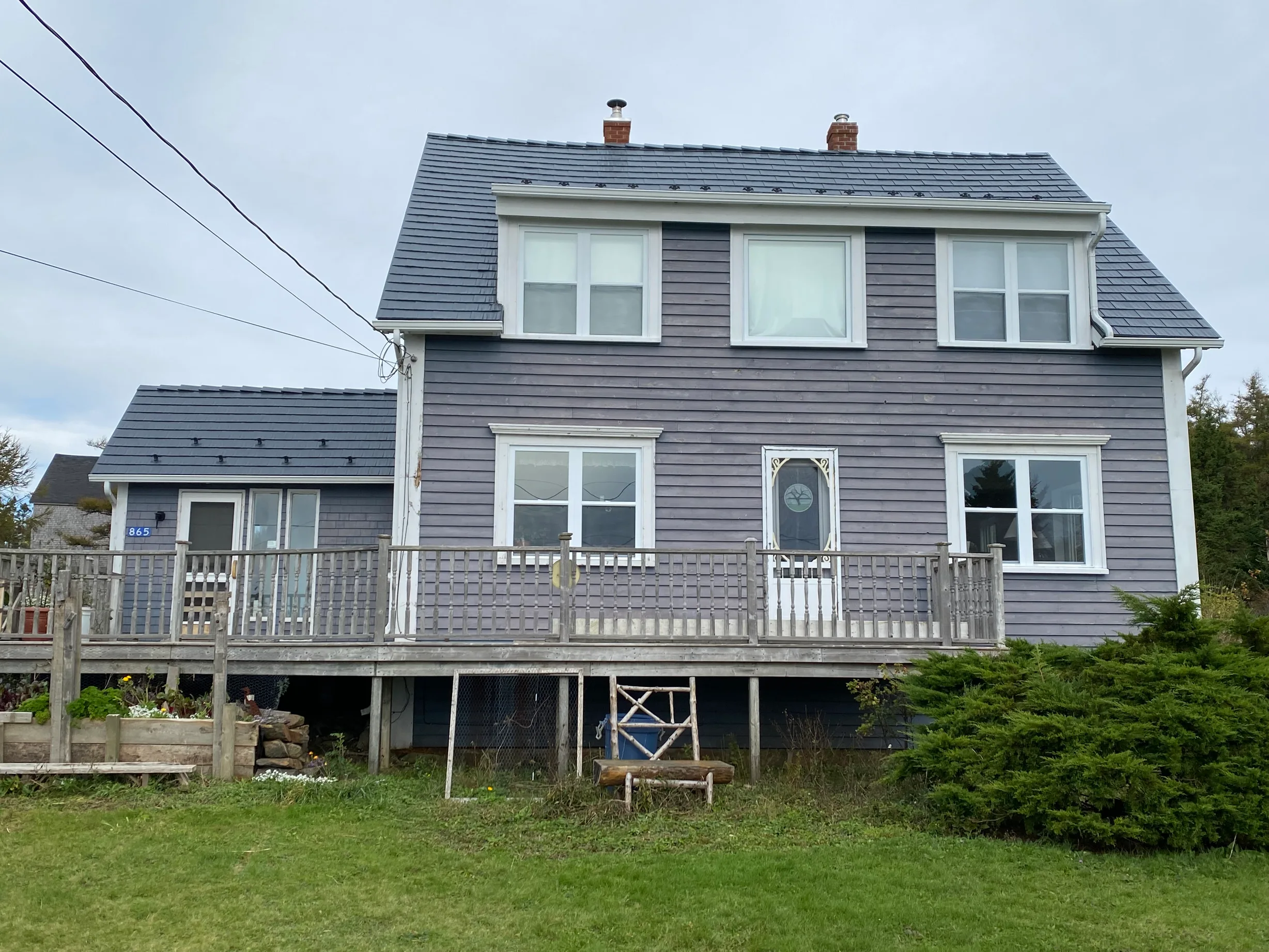 Deep Charcoal Interlock Cedar Shingle aluminum roof on the home, Kingsburg, Nova Scotia