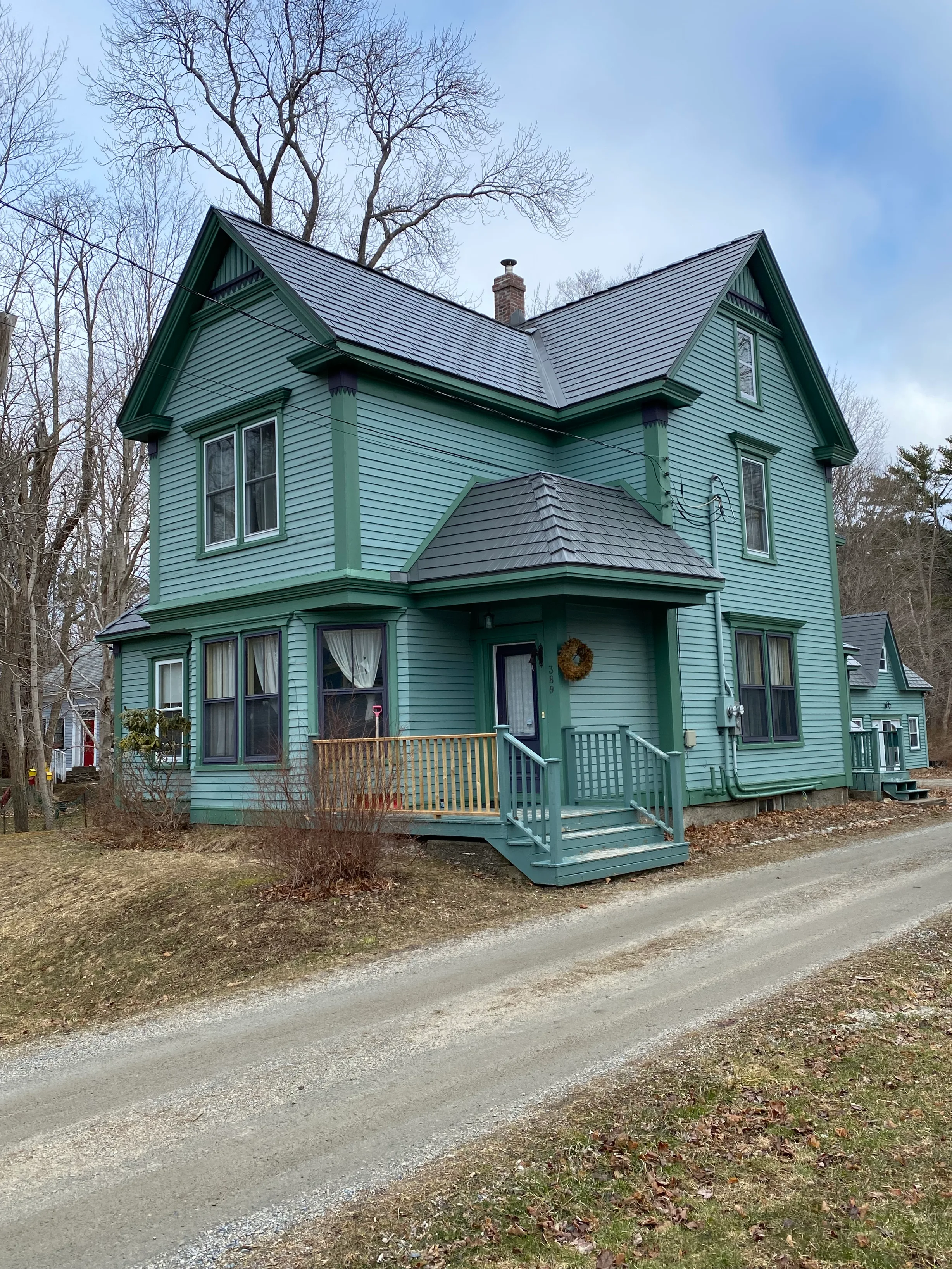 Musket Grey Interlock Cedar Shingle aluminum roof on the home with chimney and dormer, Mahone Bay, Nova Scotia