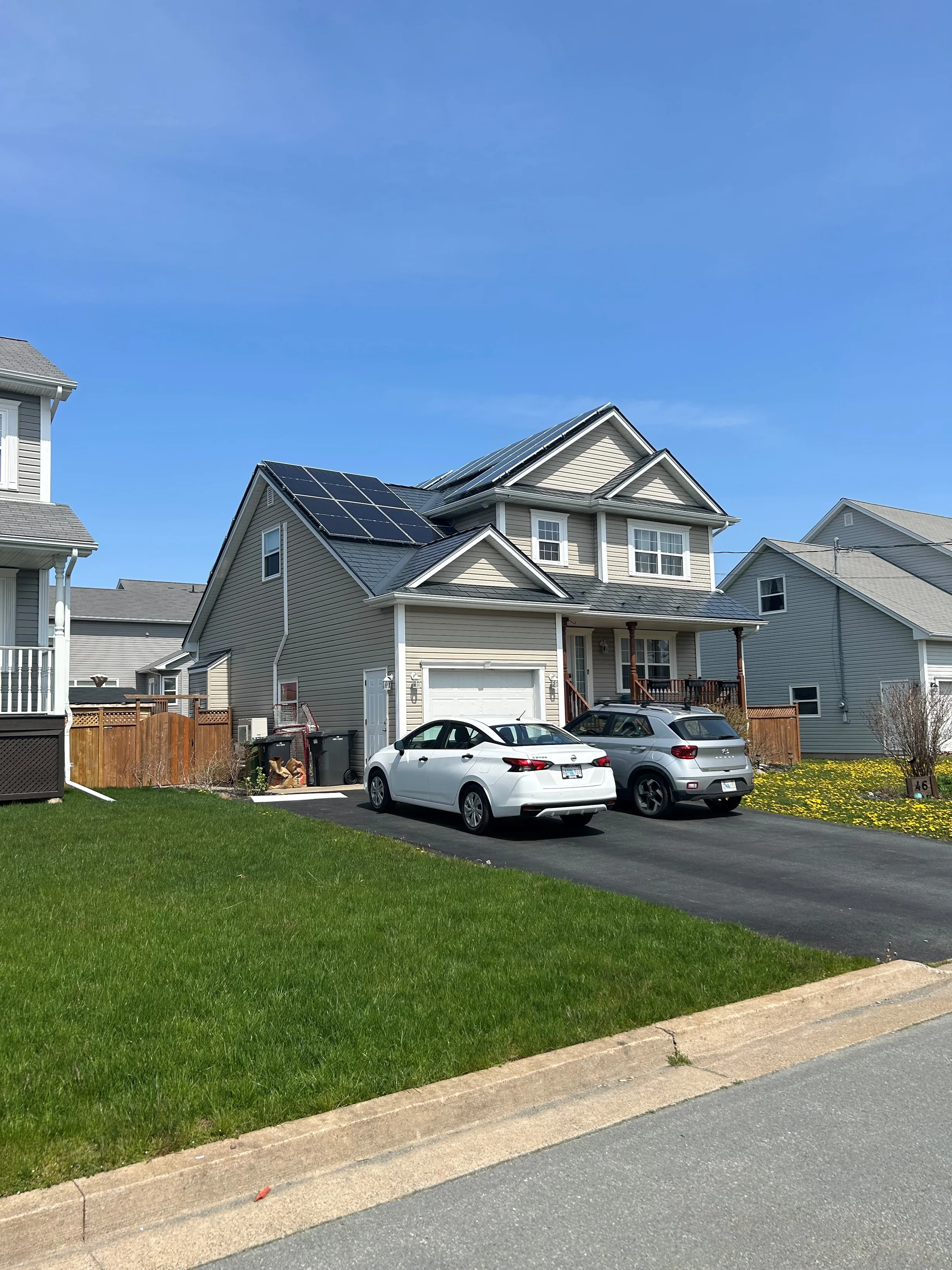 Deep Charcoal Interlock Slate aluminum roof on the home with solar panels, Eastern Passage, Nova Scotia