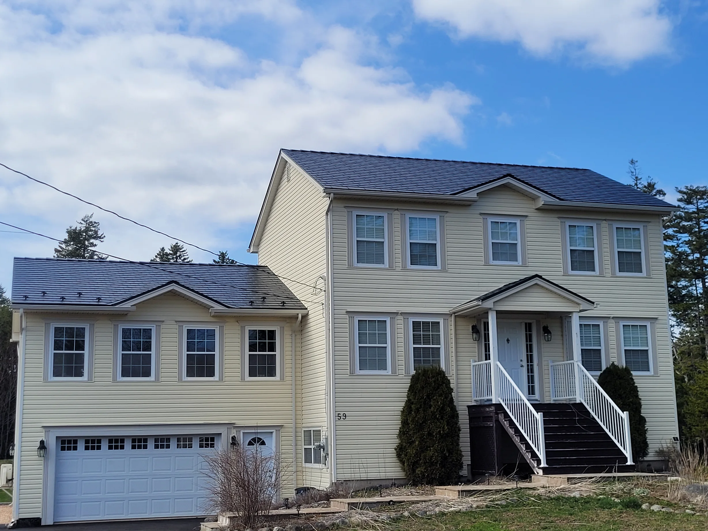 Black Interlock Slate aluminum roof on the home, Hammonds Plains, Nova Scotia