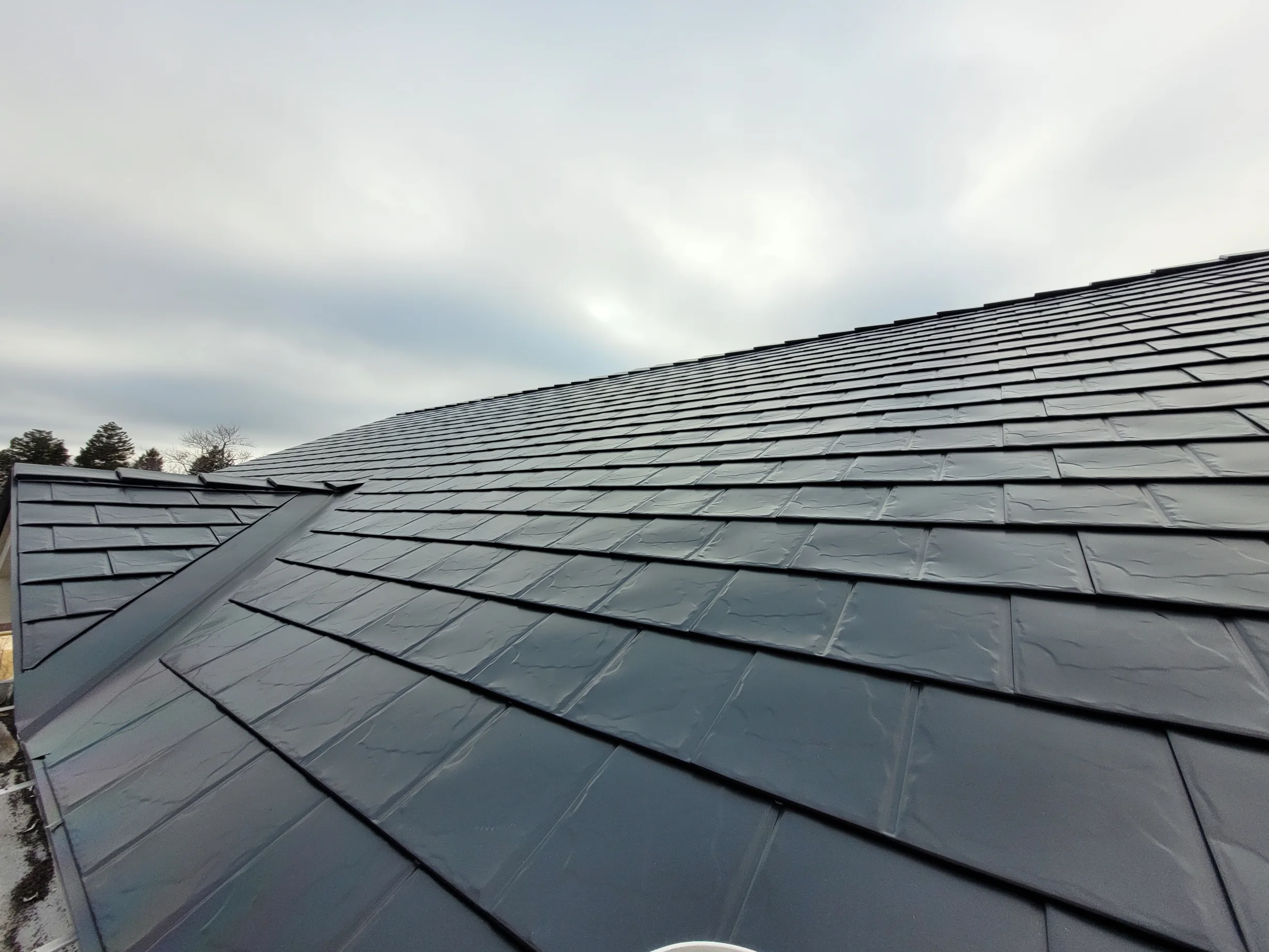 Black Interlock Slate aluminum roof on the home, Hammonds Plains, Nova Scotia