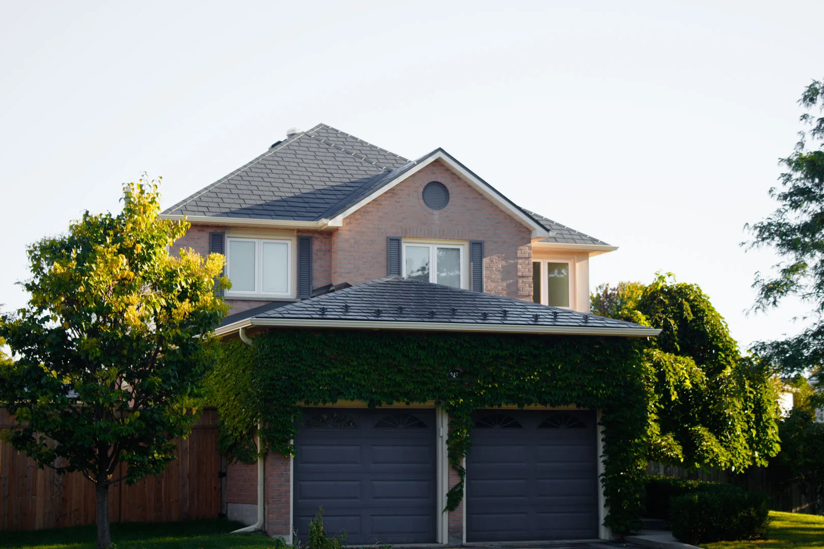 Deep Charcoal Interlock Slate aluminum roof on a Deep Charcoal metal roof on a two-storey home in a, Burlington, Ontario