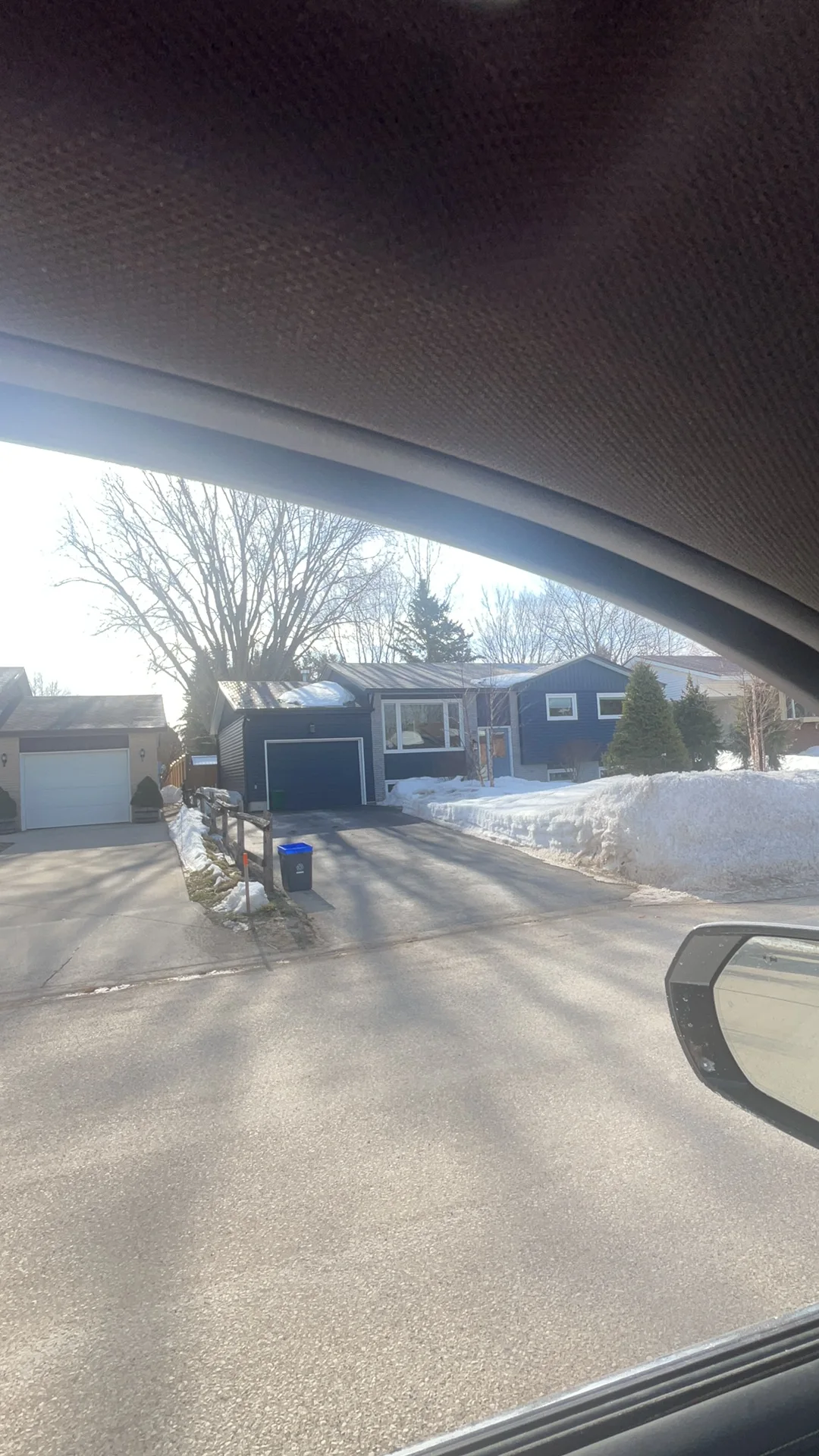 Tudor Brown Interlock Slate aluminum roof being installed on the home, replacing an asphalt shingle roof being torn off, Thornbury, Ontario