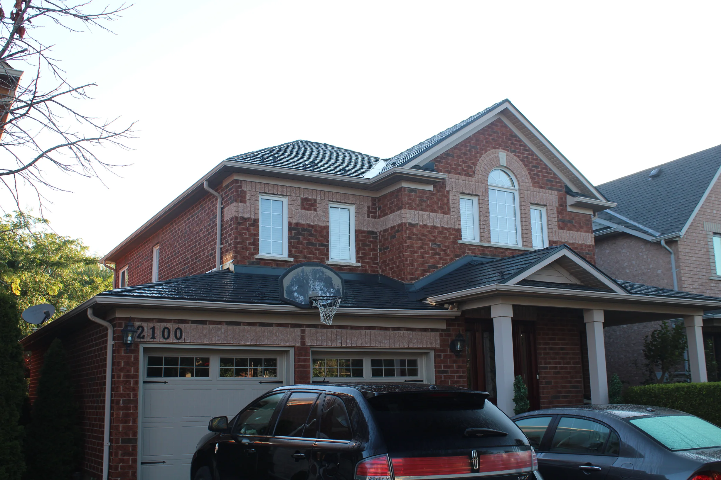 Musket Grey Interlock Slate aluminum roof on a two-storey colonial home with dormers in a suburban, Caledonia, Ontario
