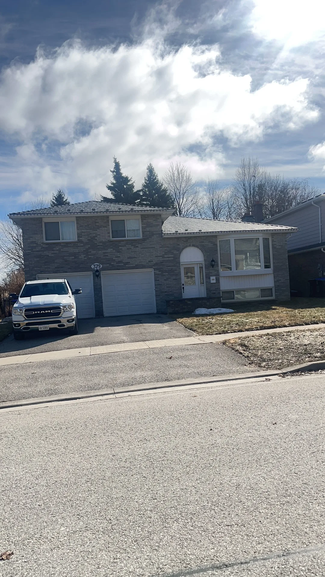 Deep Charcoal Interlock Slate aluminum roof on a two-storey home with a metal roof in a suburban, Bradford, Ontario