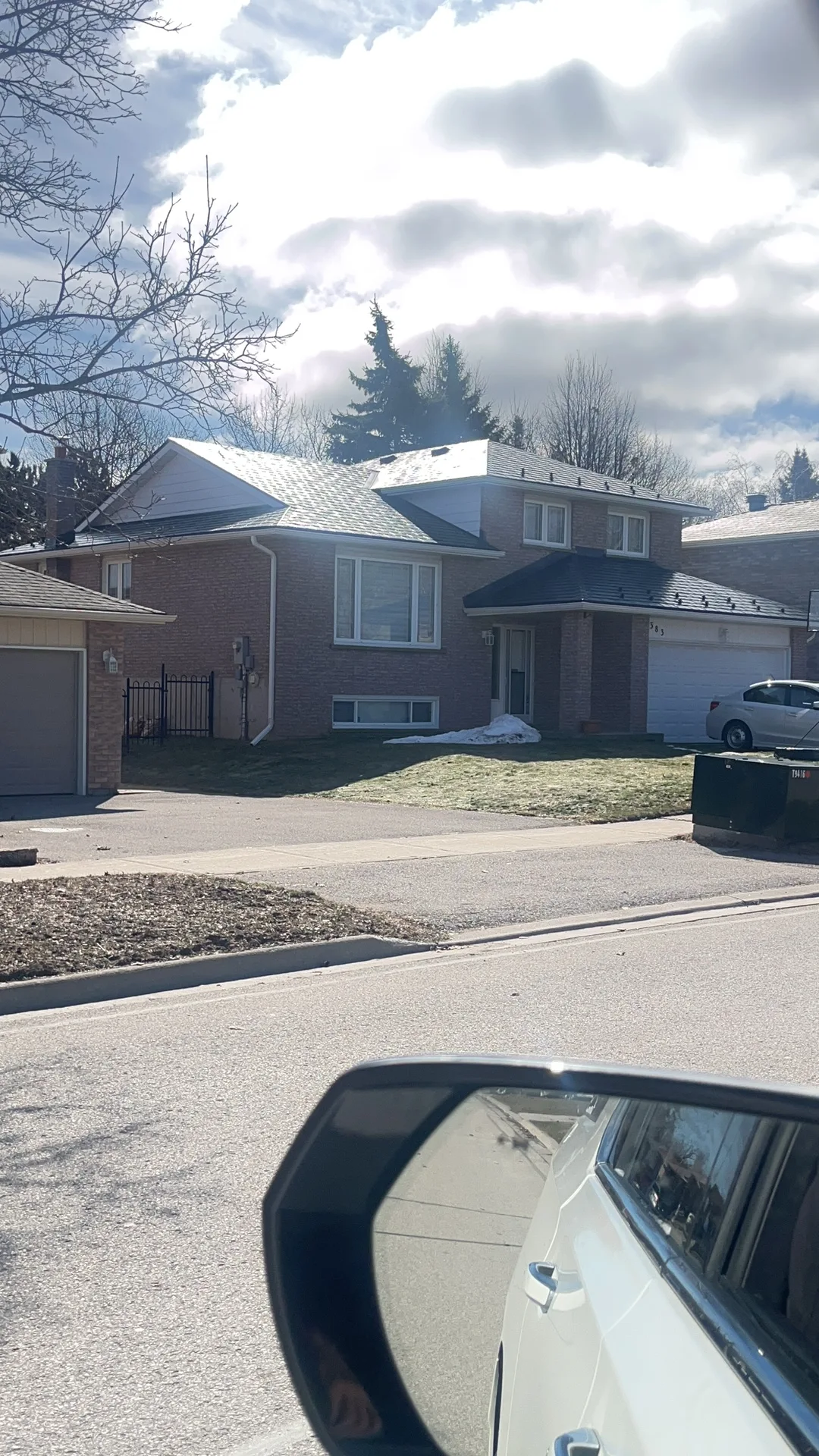 Deep Charcoal Interlock Slate aluminum roof on a two-storey home with dormers among tall pines, Bradford, Ontario