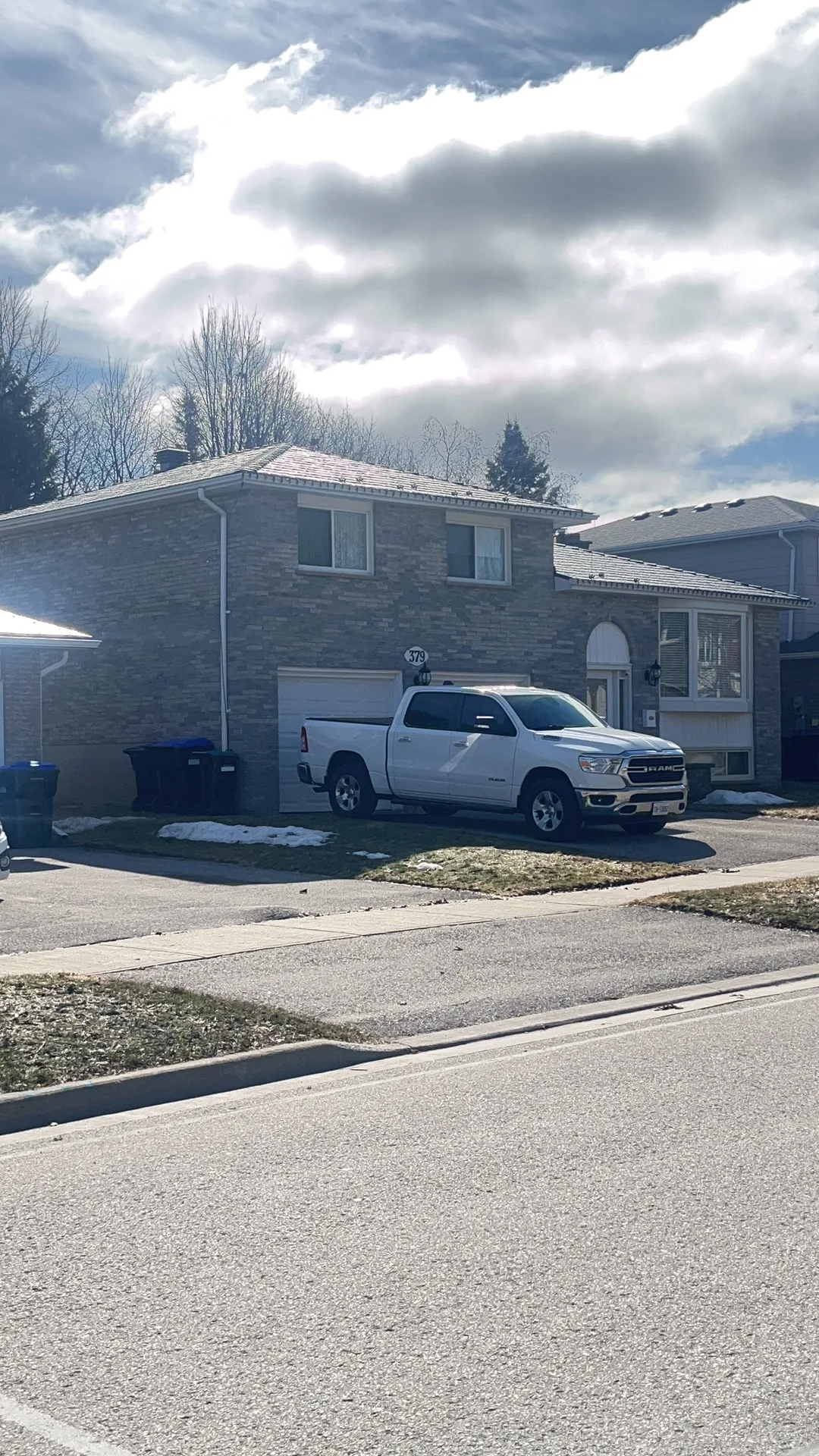 Deep Charcoal Interlock Slate aluminum roof being installed on the home, replacing an asphalt shingle roof being torn off, Bradford, Ontario