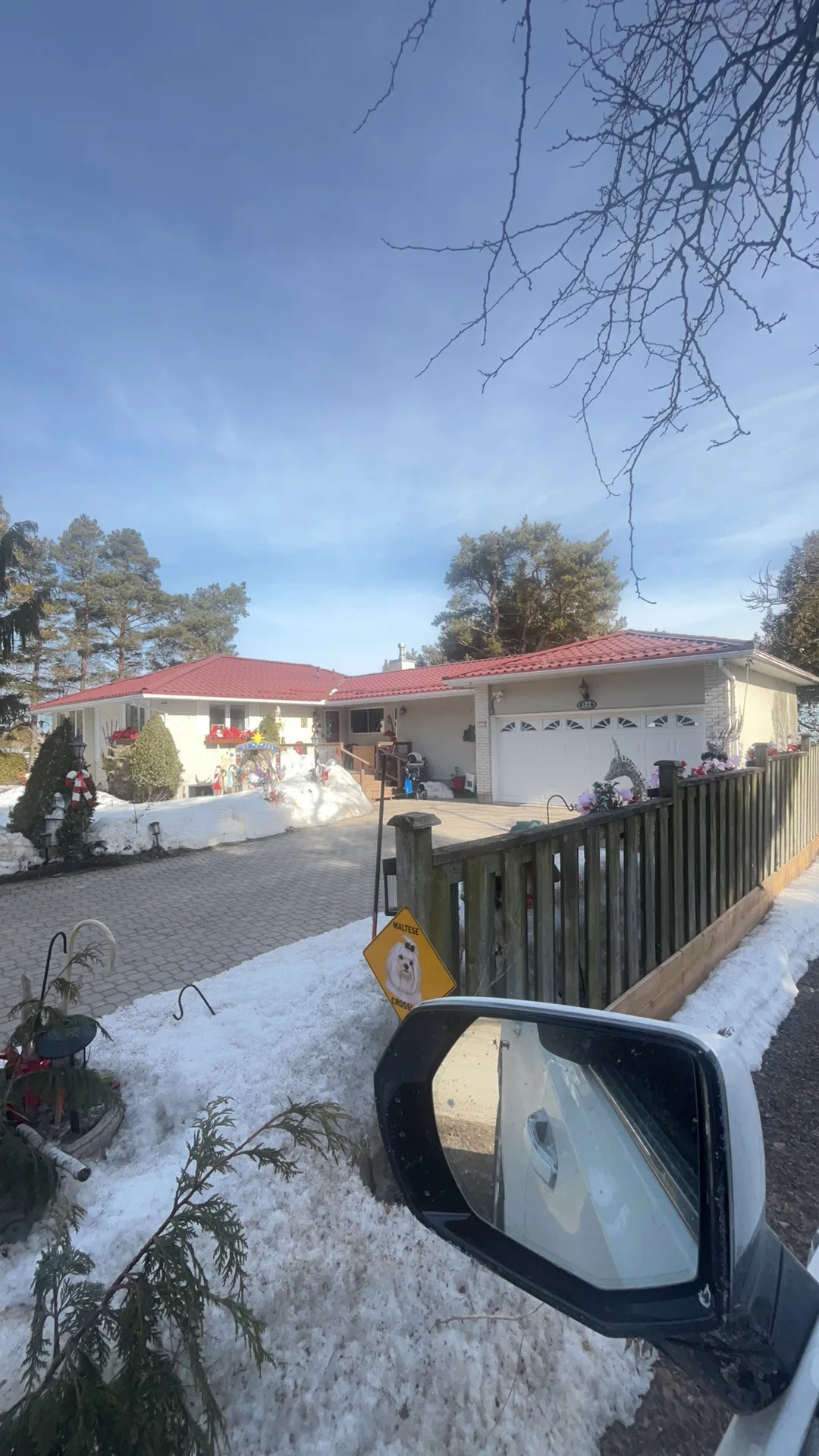 Tile Red Interlock Tile aluminum roof on a red roofed white single-family home with a white garage, Thornbury, Ontario