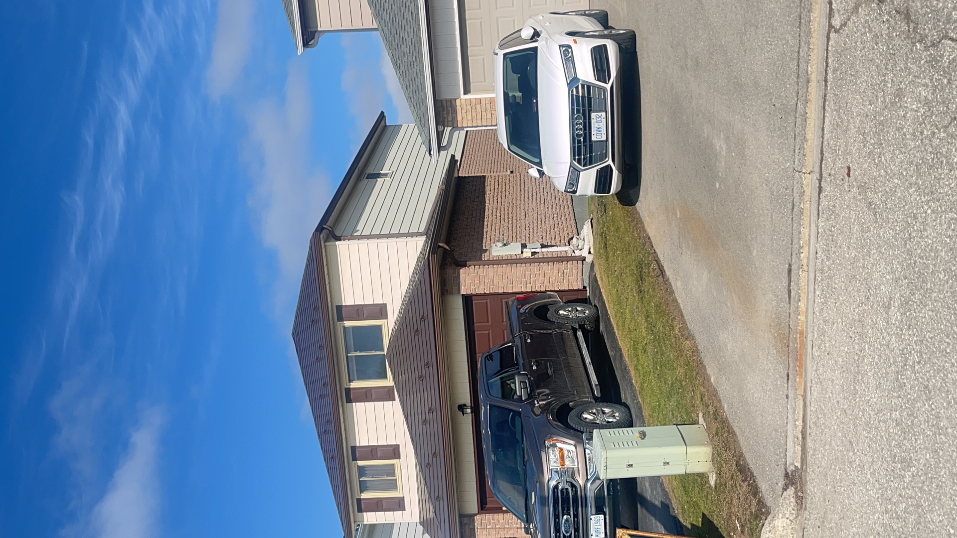 Two-storey Colonial home in Bradford, ON with Interlock aluminum slate roofing in Colonial Brown, hip roof profile, viewed from front elevation.