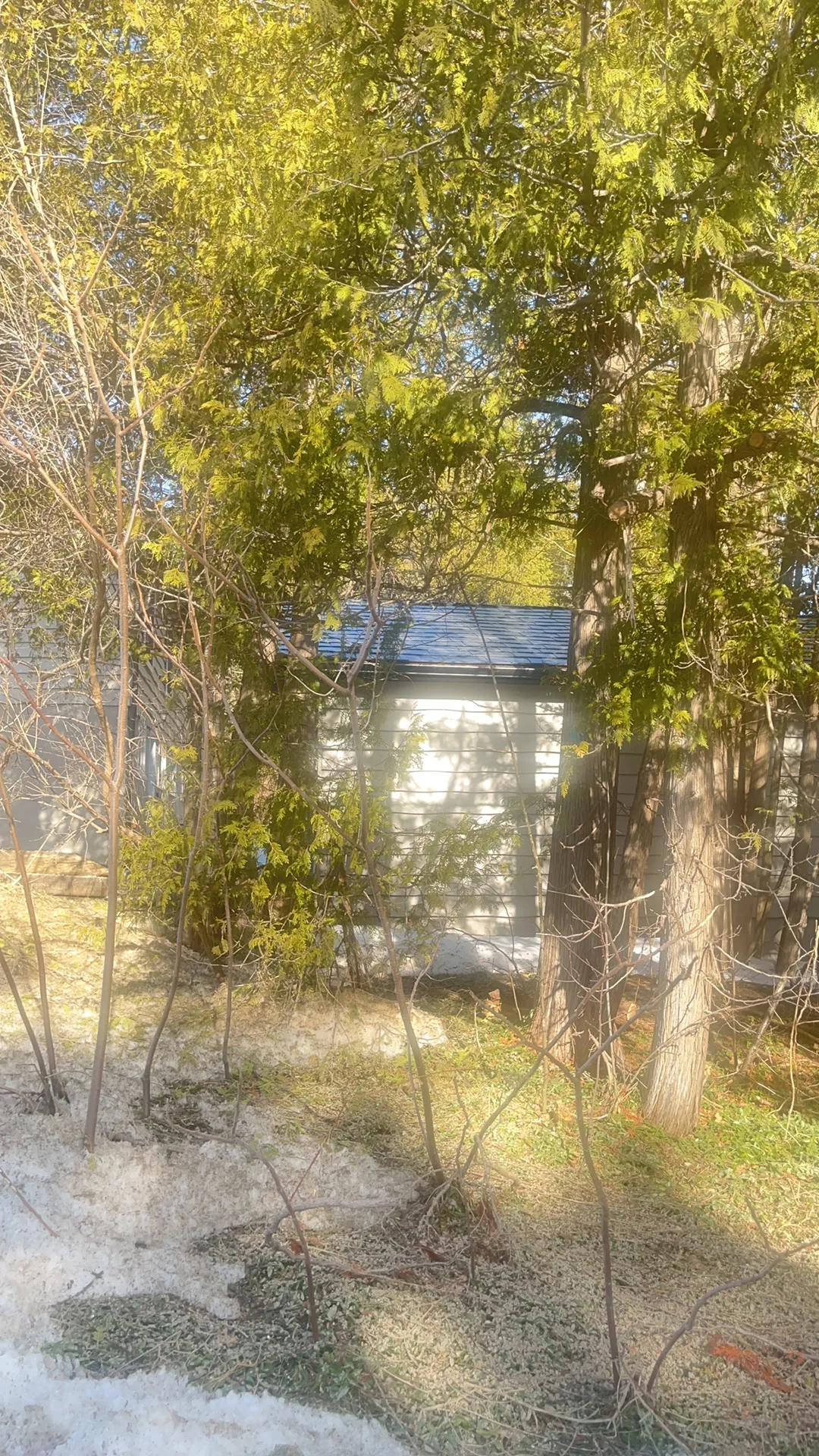 Black Interlock Slate aluminum roof being installed on a metal roof being installed on a home in the Blue Mountains, The Blue Mountain, Ontario