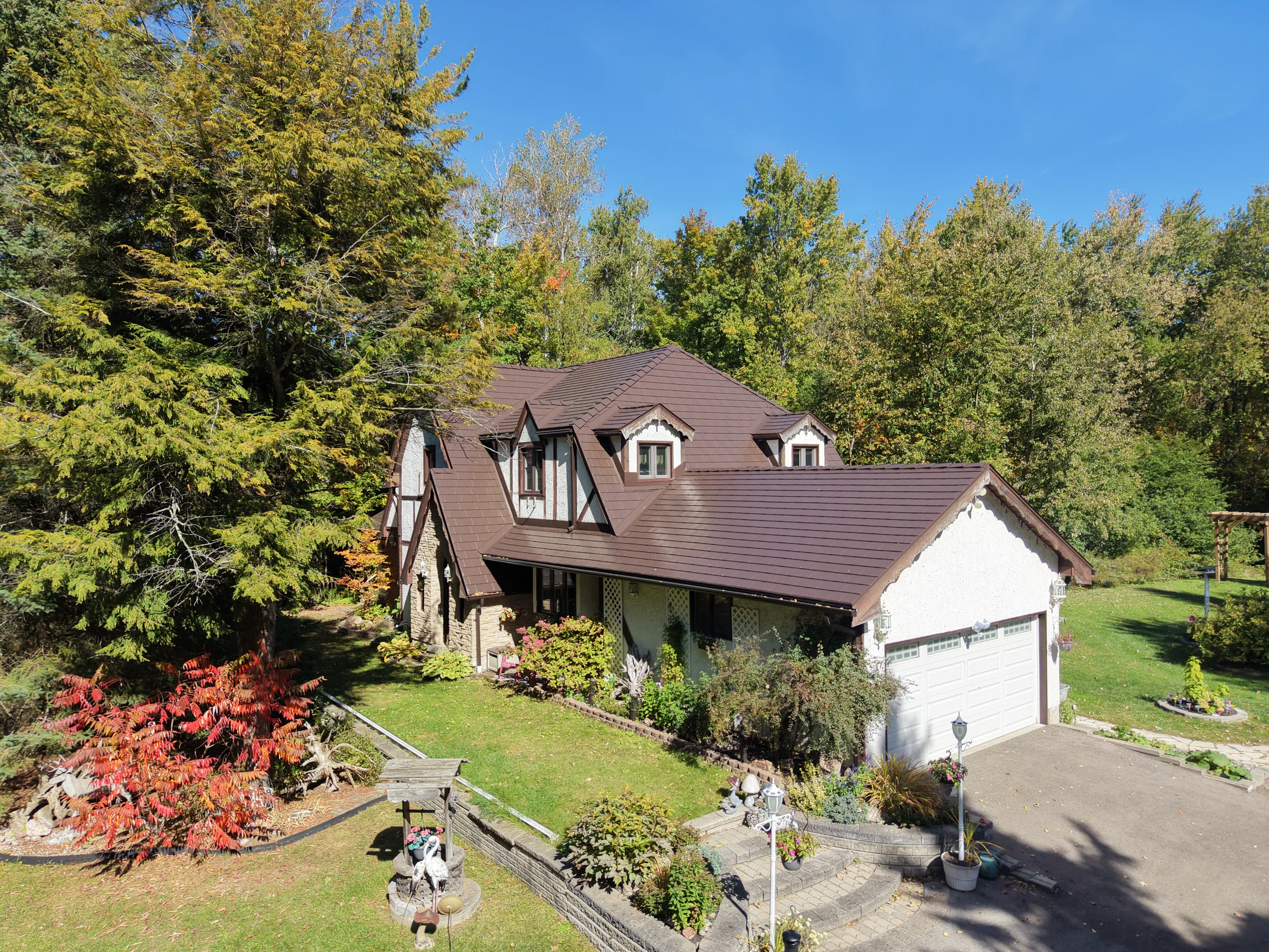 Colonial Brown Interlock Slate aluminum roof on a Colonial home with dormers in a rural setting, Fraserville, Ontario