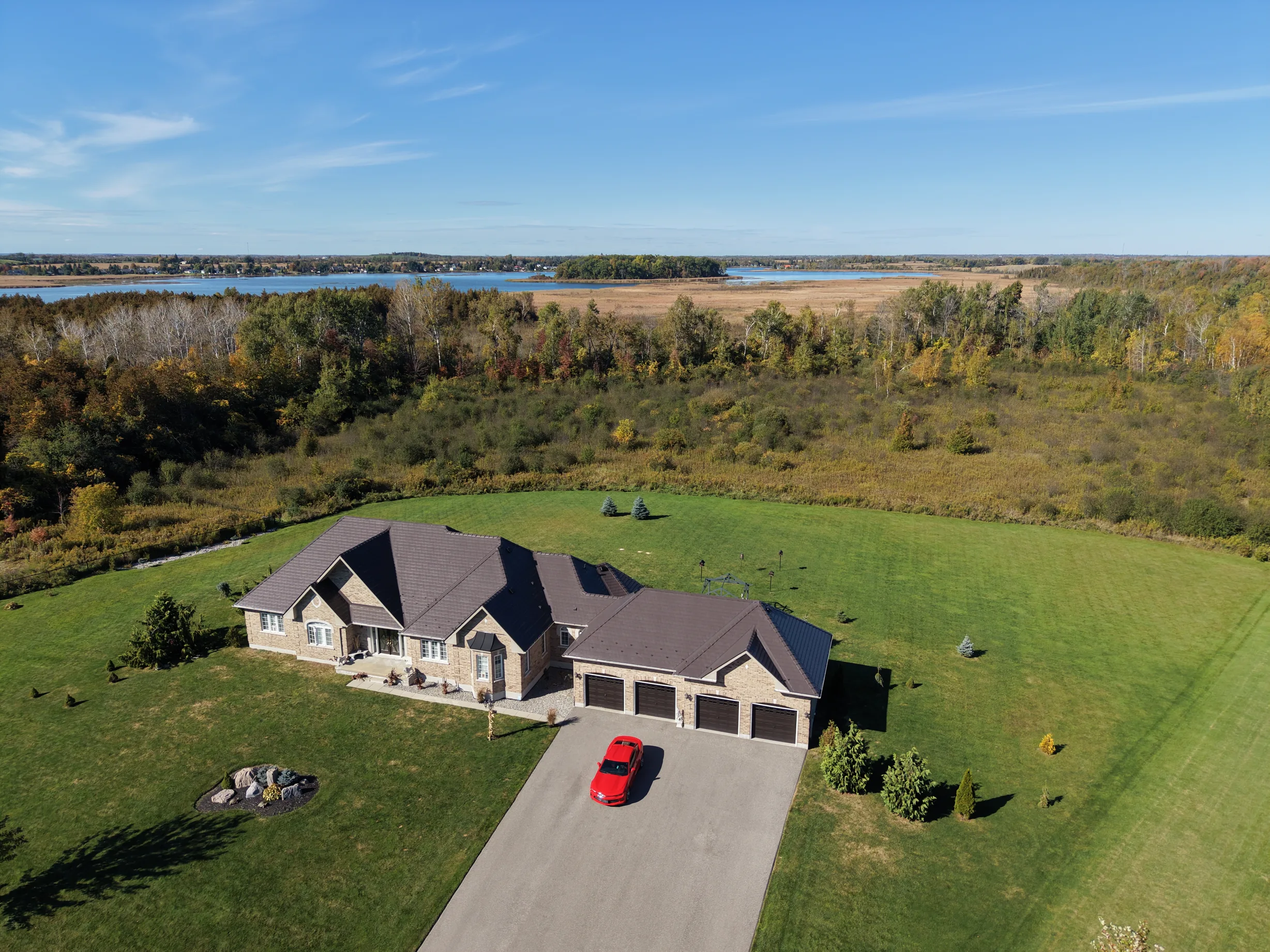 Tudor Brown Interlock Slate aluminum roof on a brown ranch home with a metal roof on a lake in a rural, Kawartha Lakes, Ontario