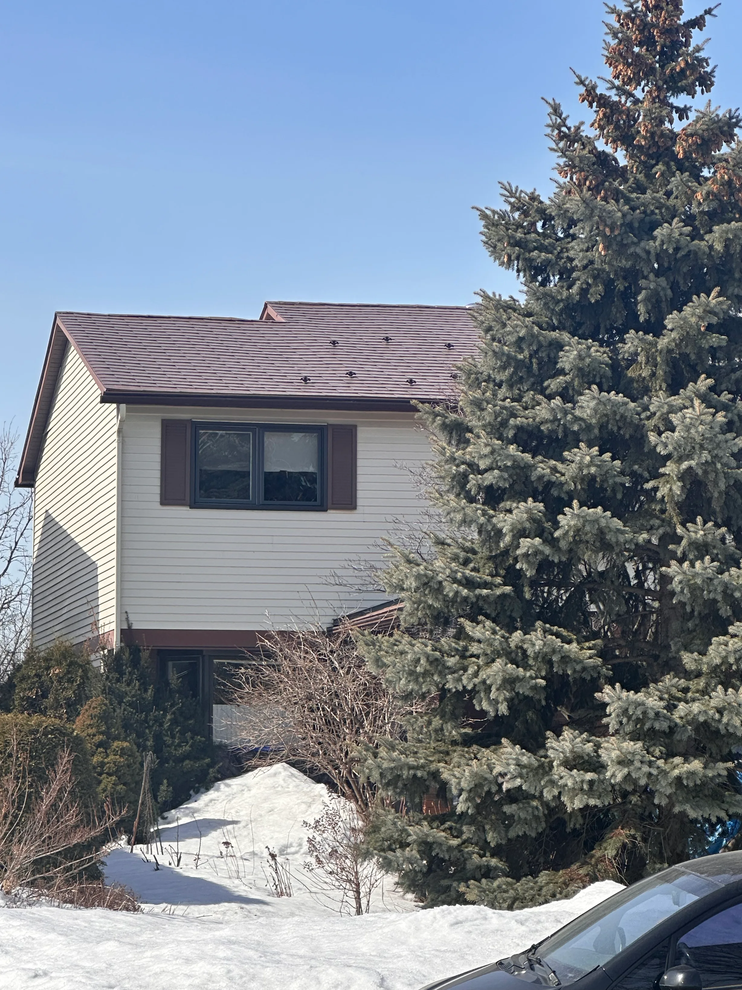 Aged Copper Interlock Shingle aluminum roof being installed on the home, replacing an asphalt shingle roof being torn off, Gloucester, Ontario