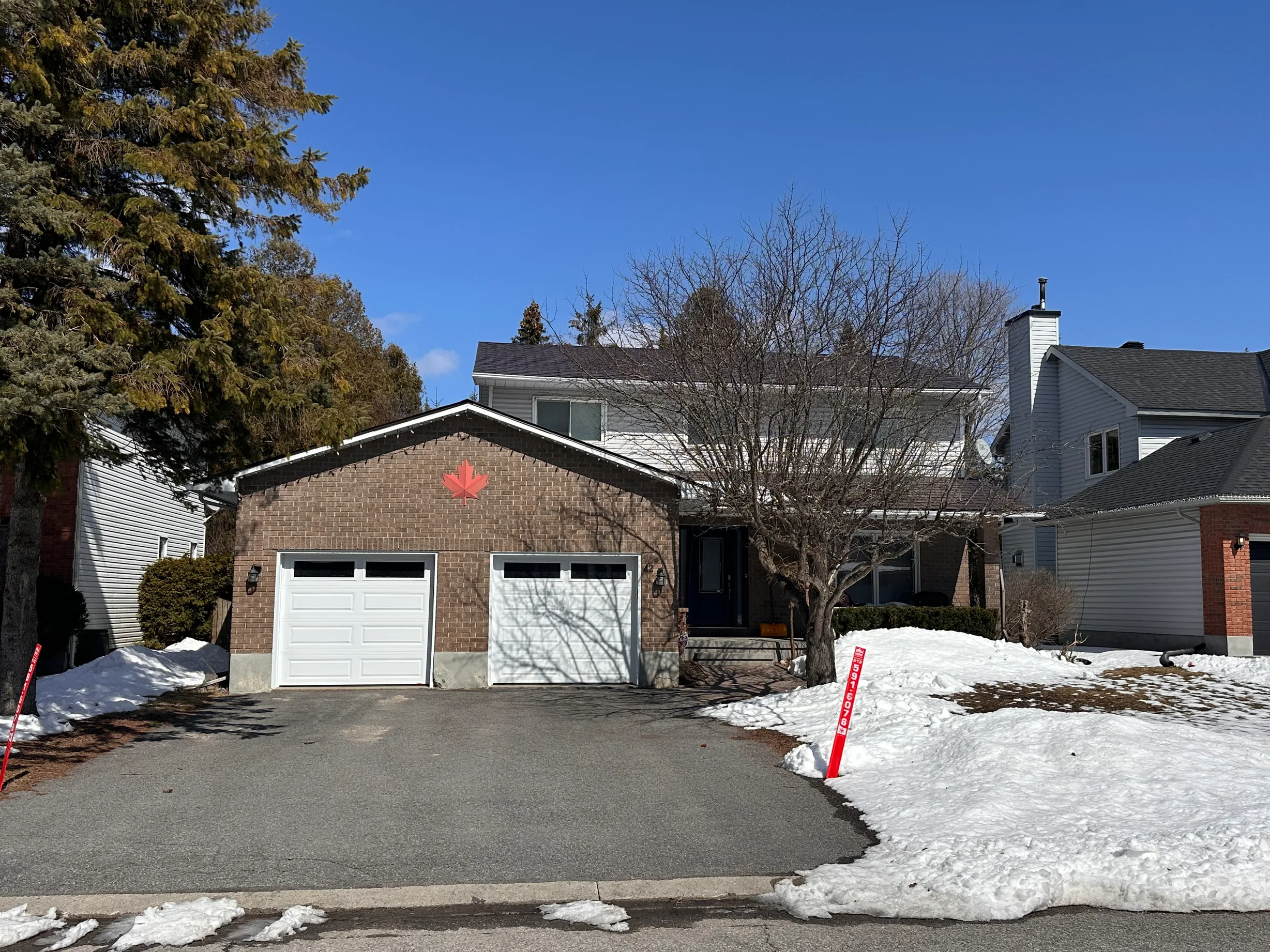 Colonial Brown Interlock Shingle aluminum roof on a brown two-storey home with a metal roof in Stittsville, Stittsville, Ontario