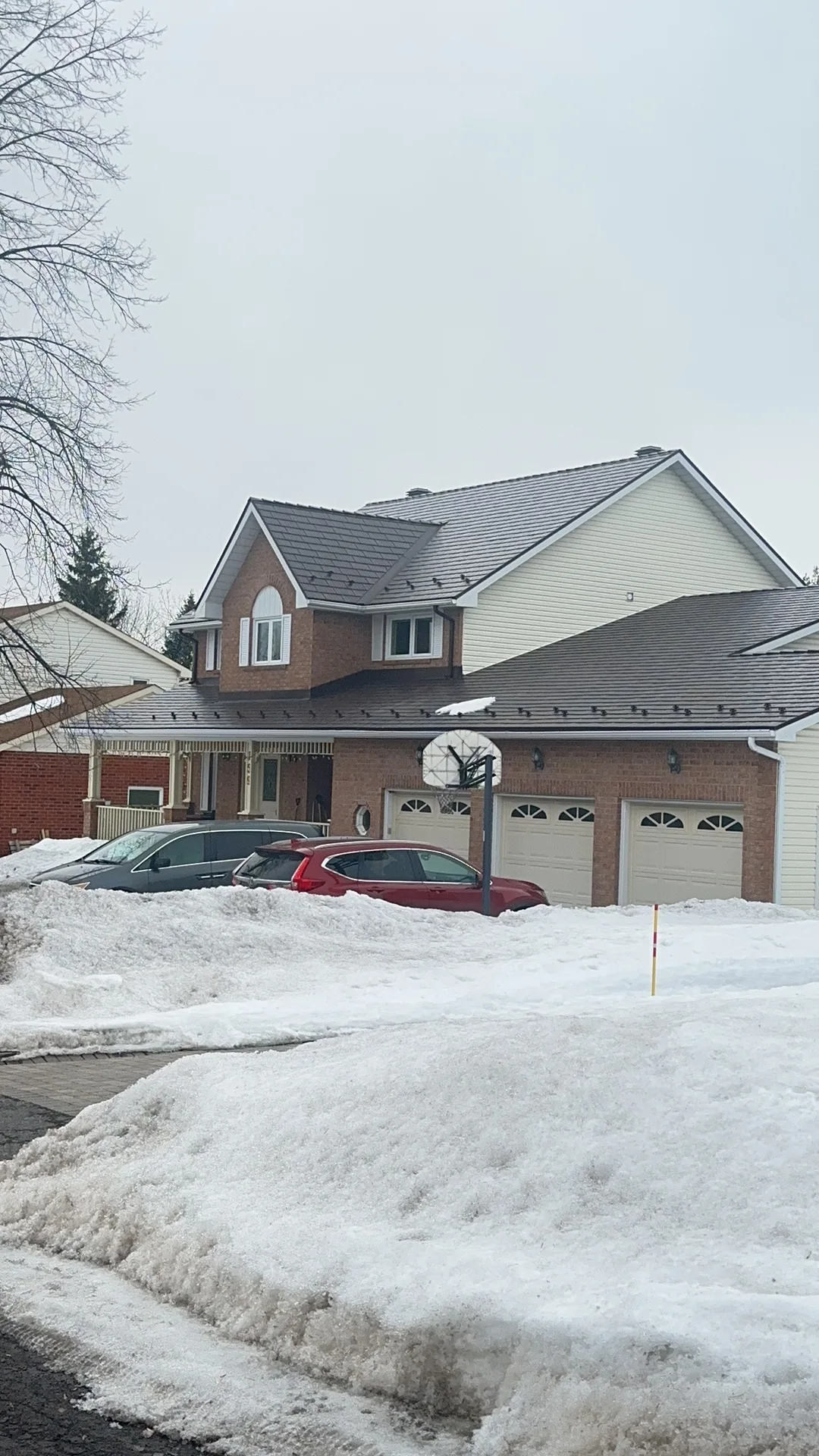 Colonial Brown Interlock Cedar Shingle aluminum roof on a two-storey Colonial home with dormers in a suburban, Ottawa, Ontario