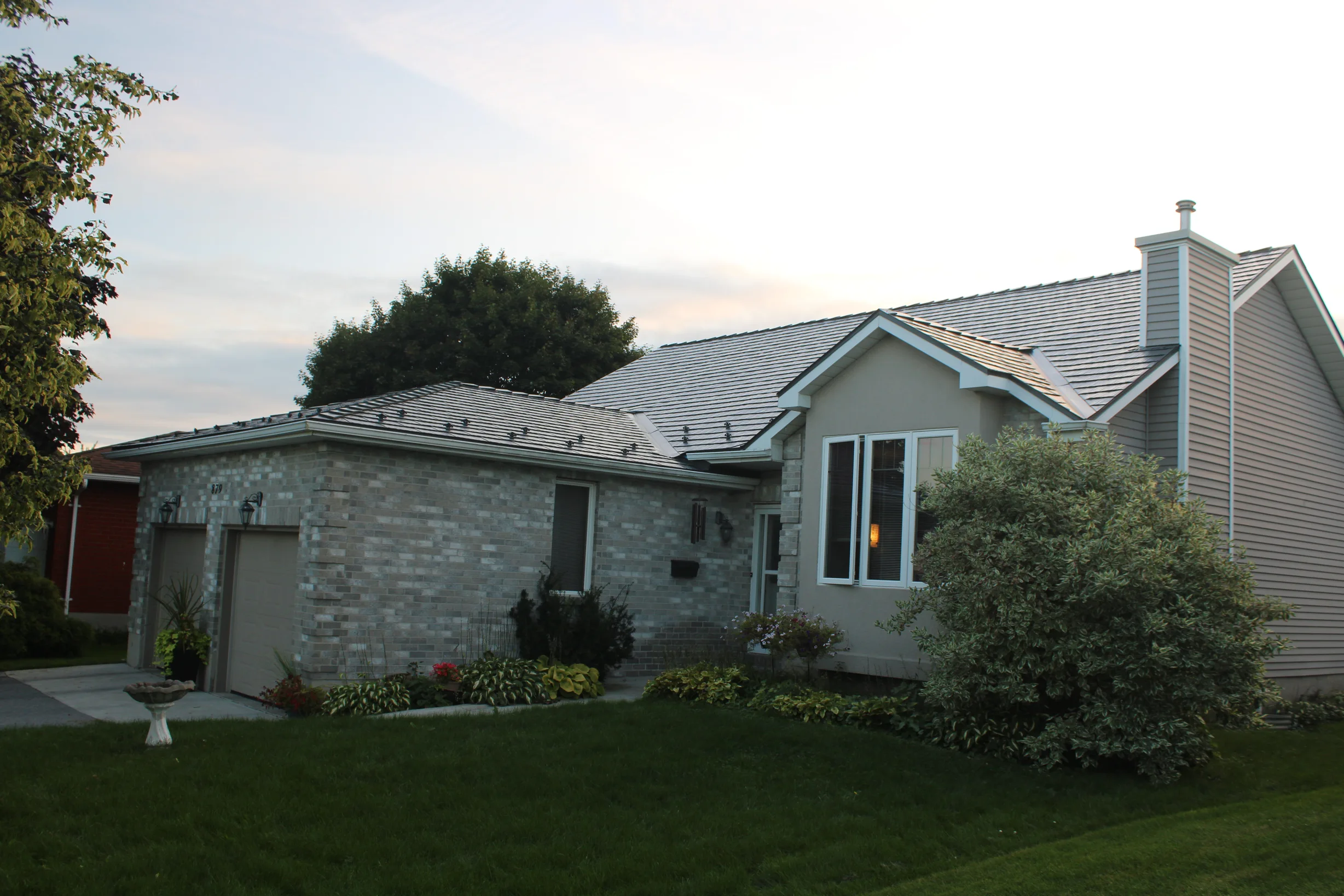 Deep Charcoal Interlock Cedar Shingle aluminum roof on a single-storey home with a grey Interlock metal roof and, Kingston, Ontario