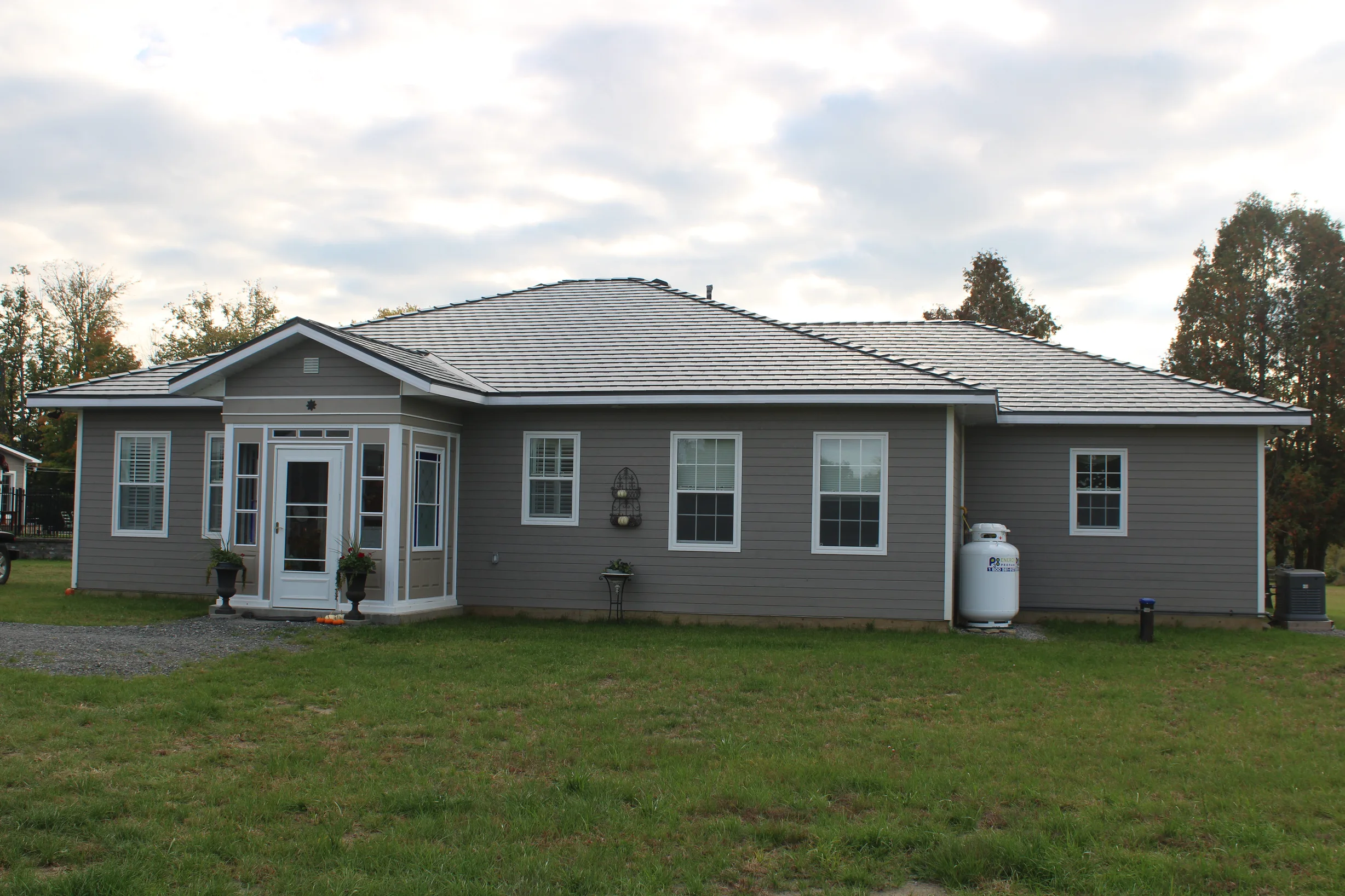 Deep Charcoal Interlock Slate aluminum roof on a Deep Charcoal metal roof on a single-storey ranch home in, Carleton Place, Ontario