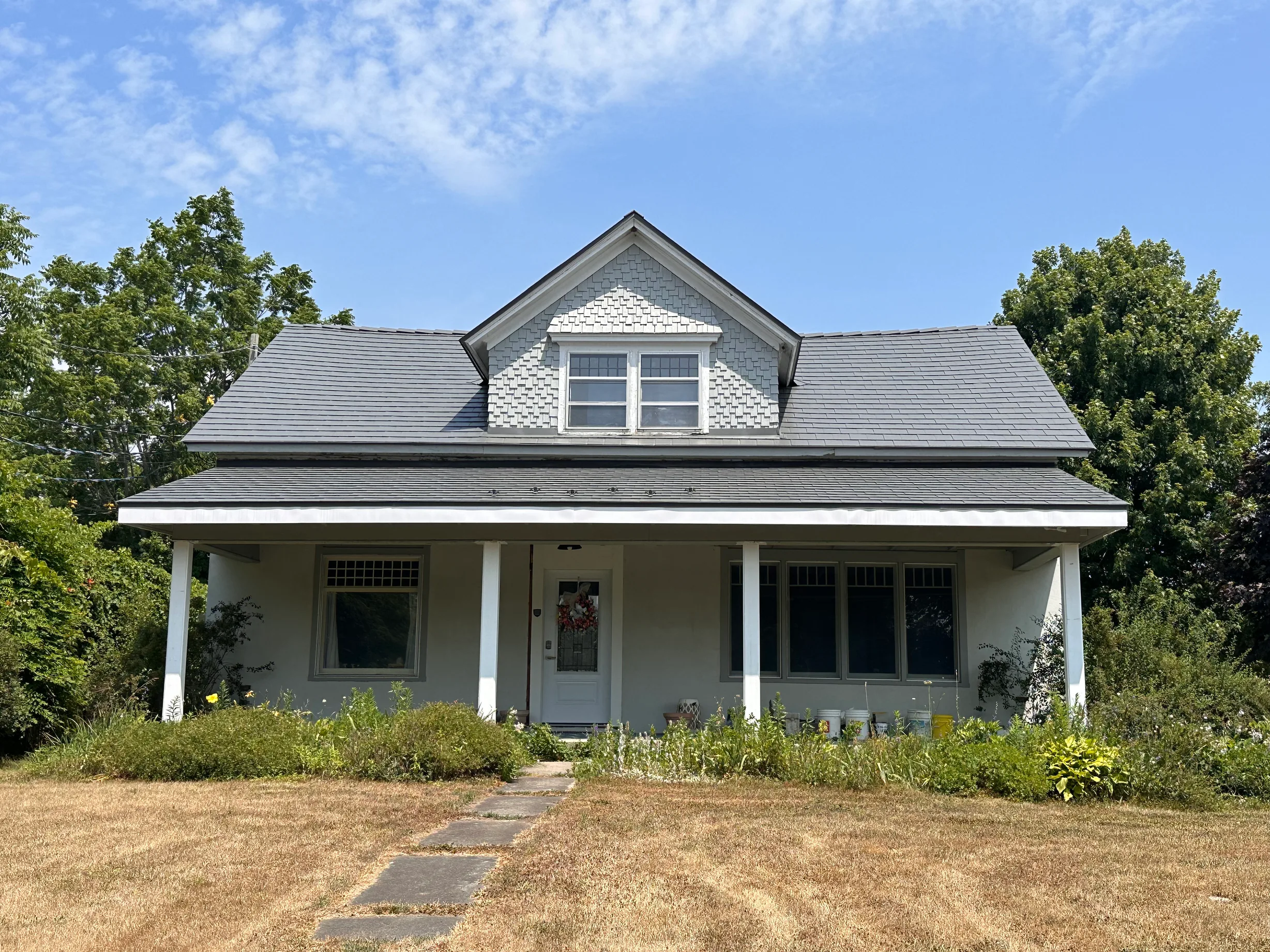 Musket Grey Interlock Slate aluminum roof on a cottage with a Musket Grey Interlock Slate metal roof, Bloomfield, Ontario